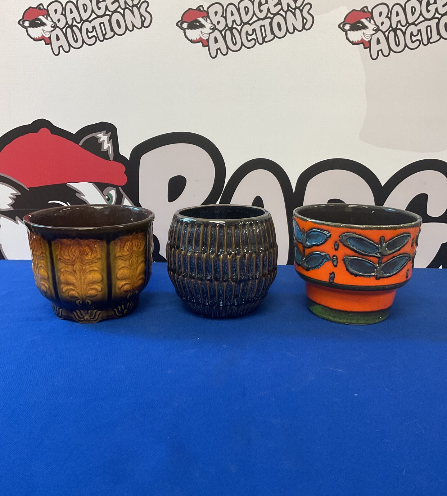 Three vintage plant pots including west german