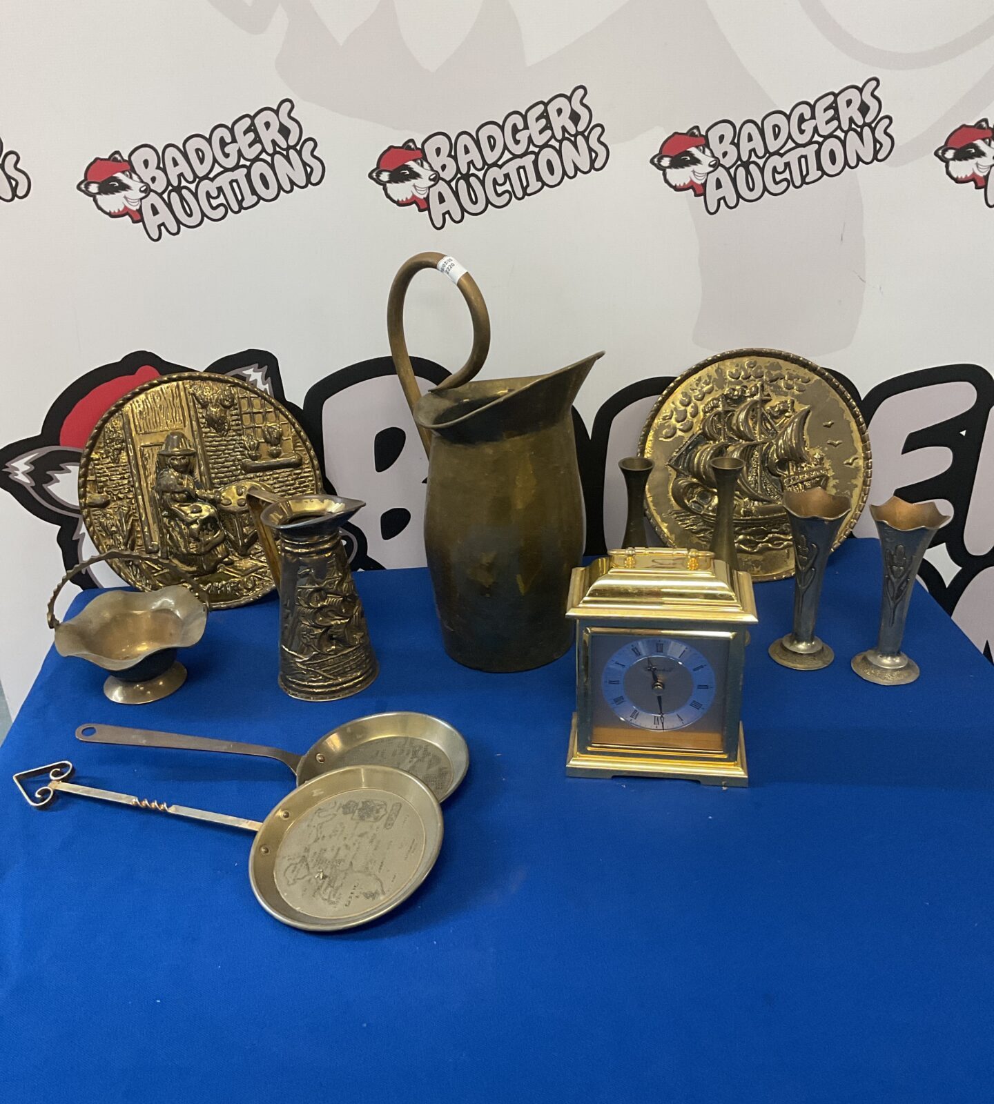Box of brassware including posy vases