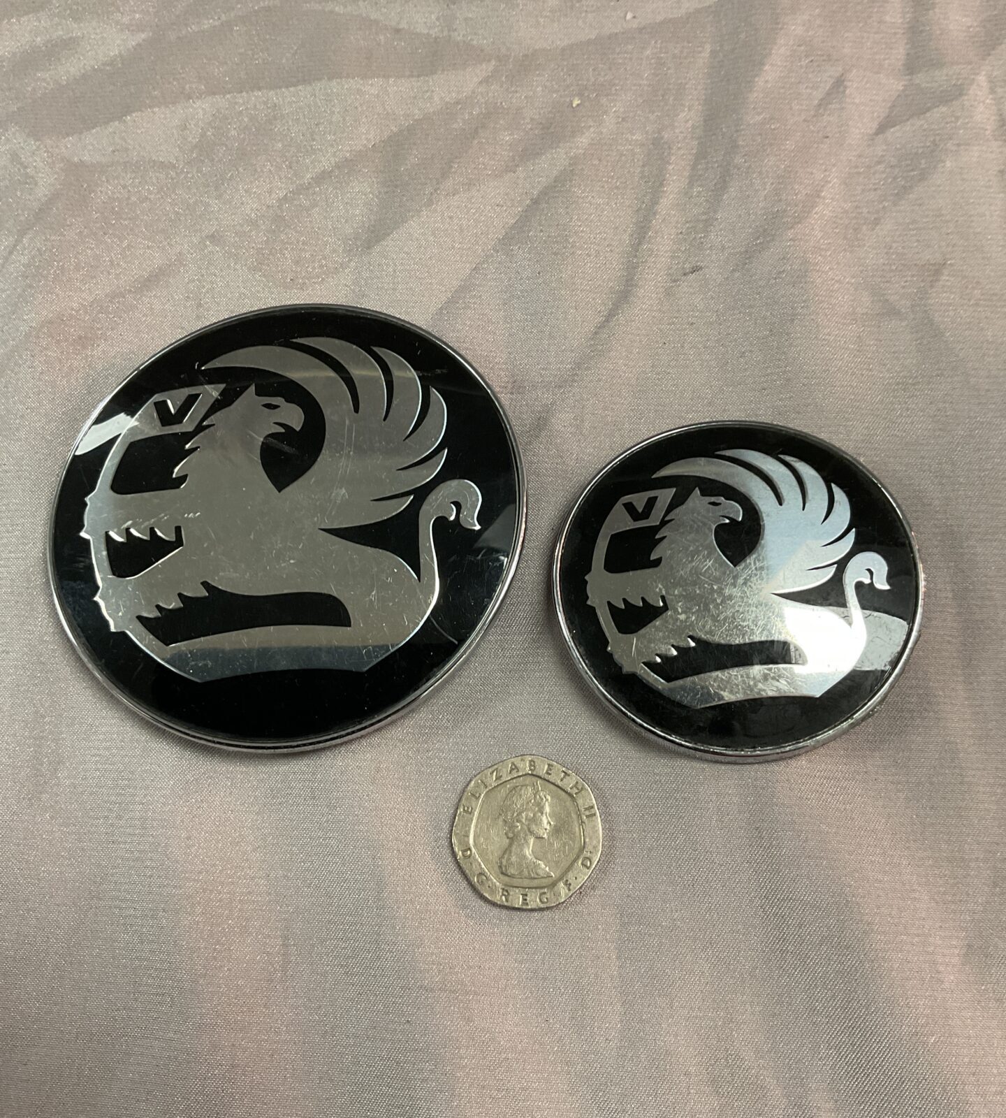 Two Vauxhall car badges