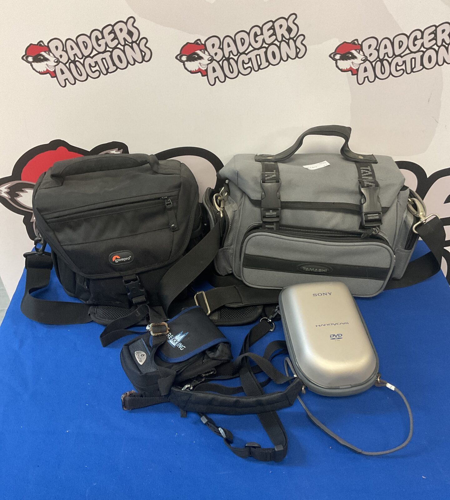 Four camera bags including lowepro & tamashi