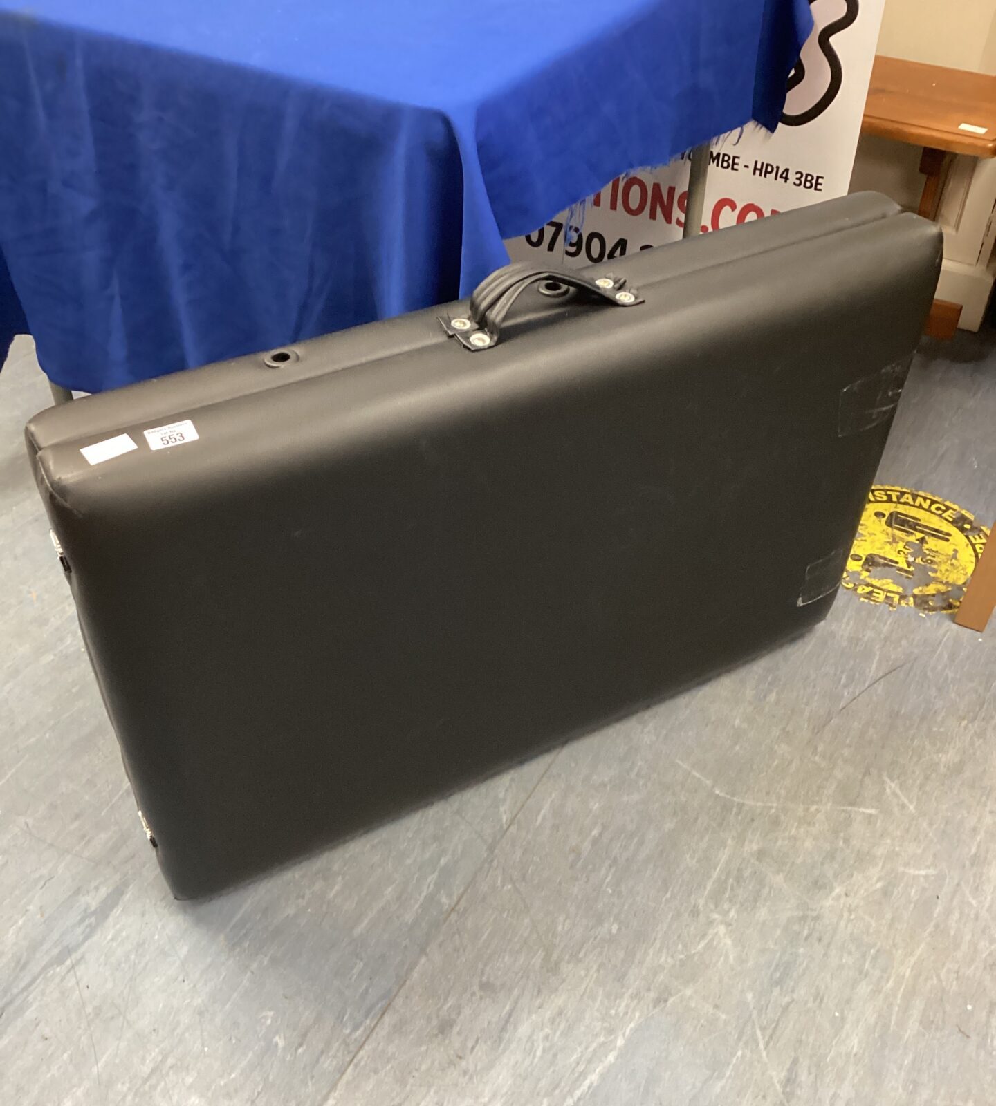 Black leather folding massage table