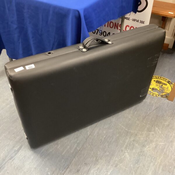 Black leather folding massage table