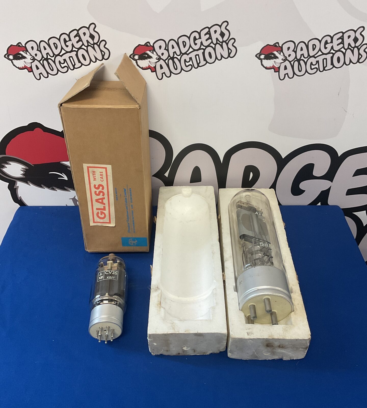Two large glass radio valves including cv26 & 4212e