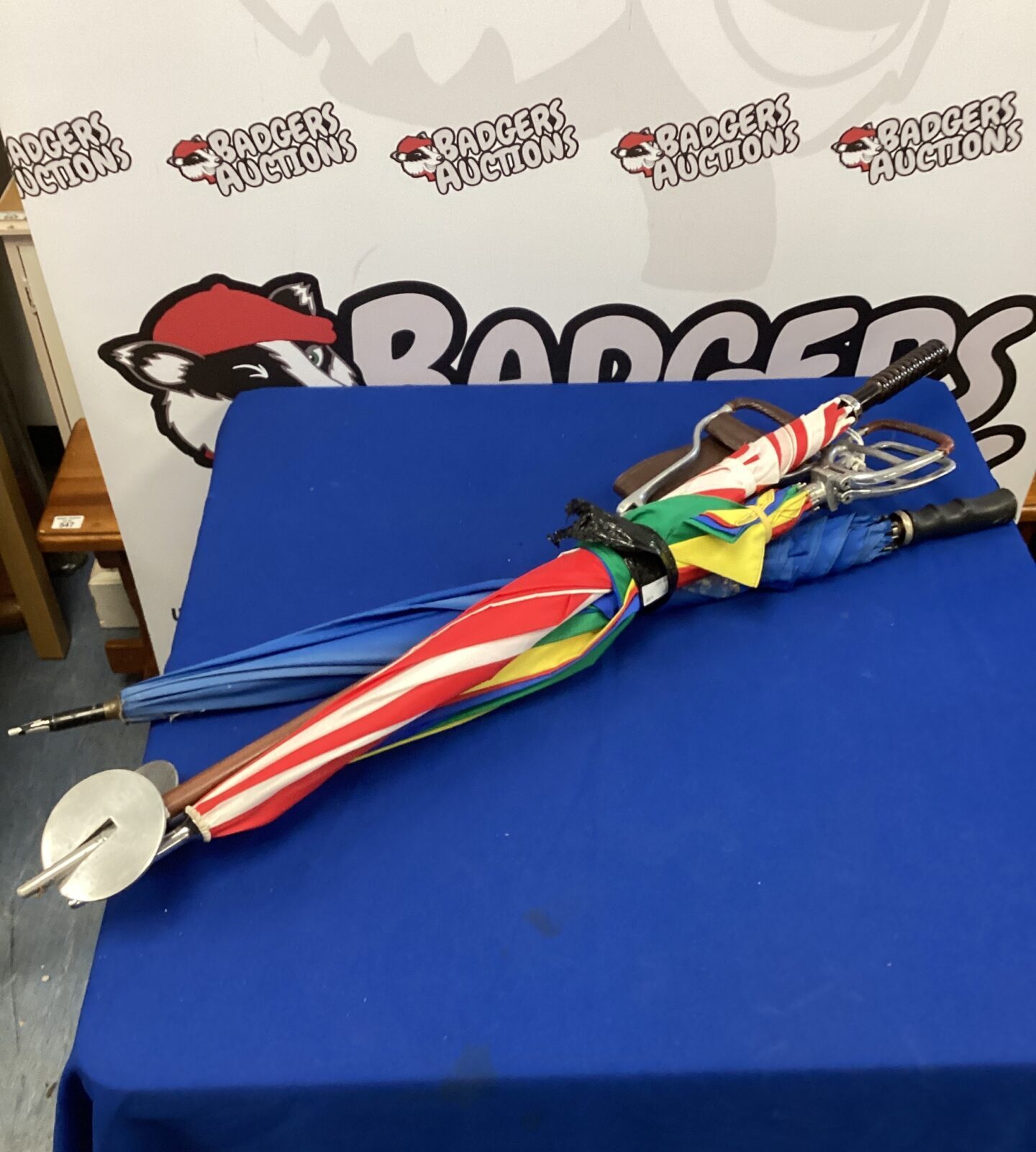 Bundle of mixed umbrellas & shooting seats
