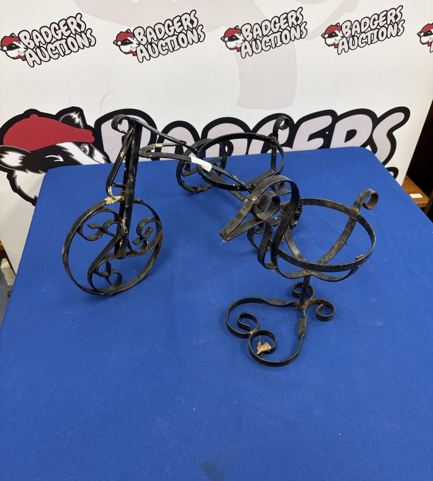 Two wrought iron plant pot holders duck & tricycle