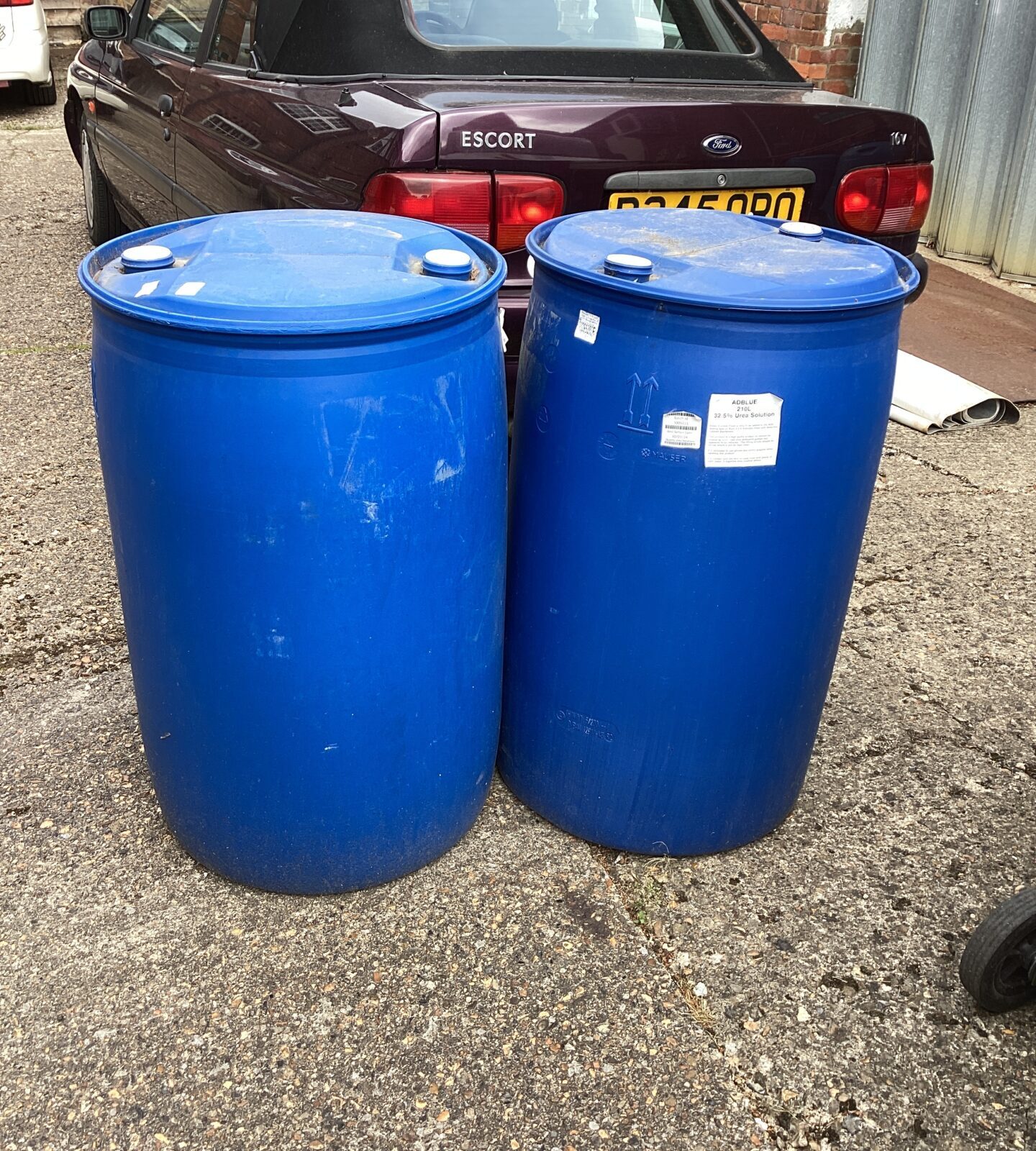 Two large blue barrels