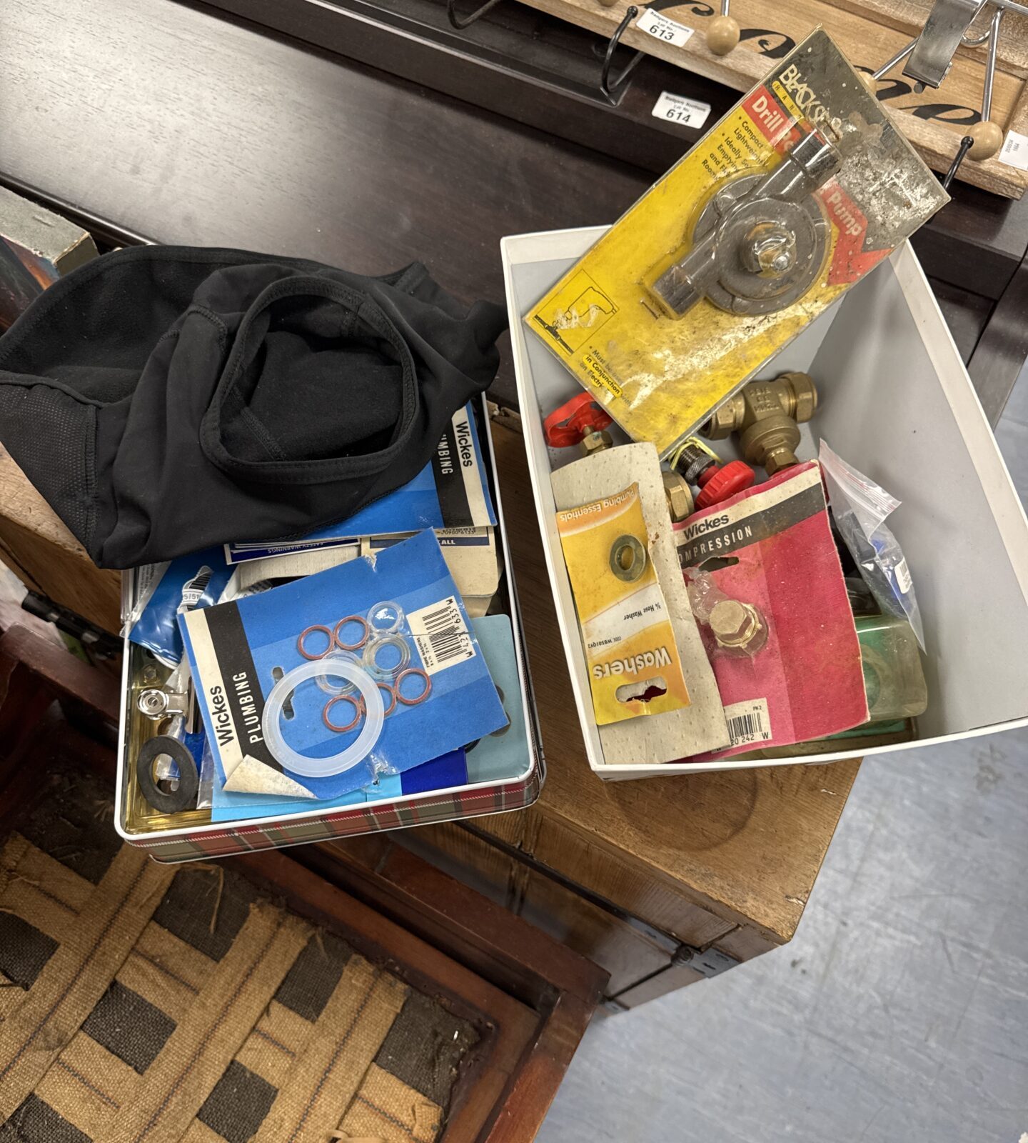 Two tins of mixed hardware items inc plumbing fittings