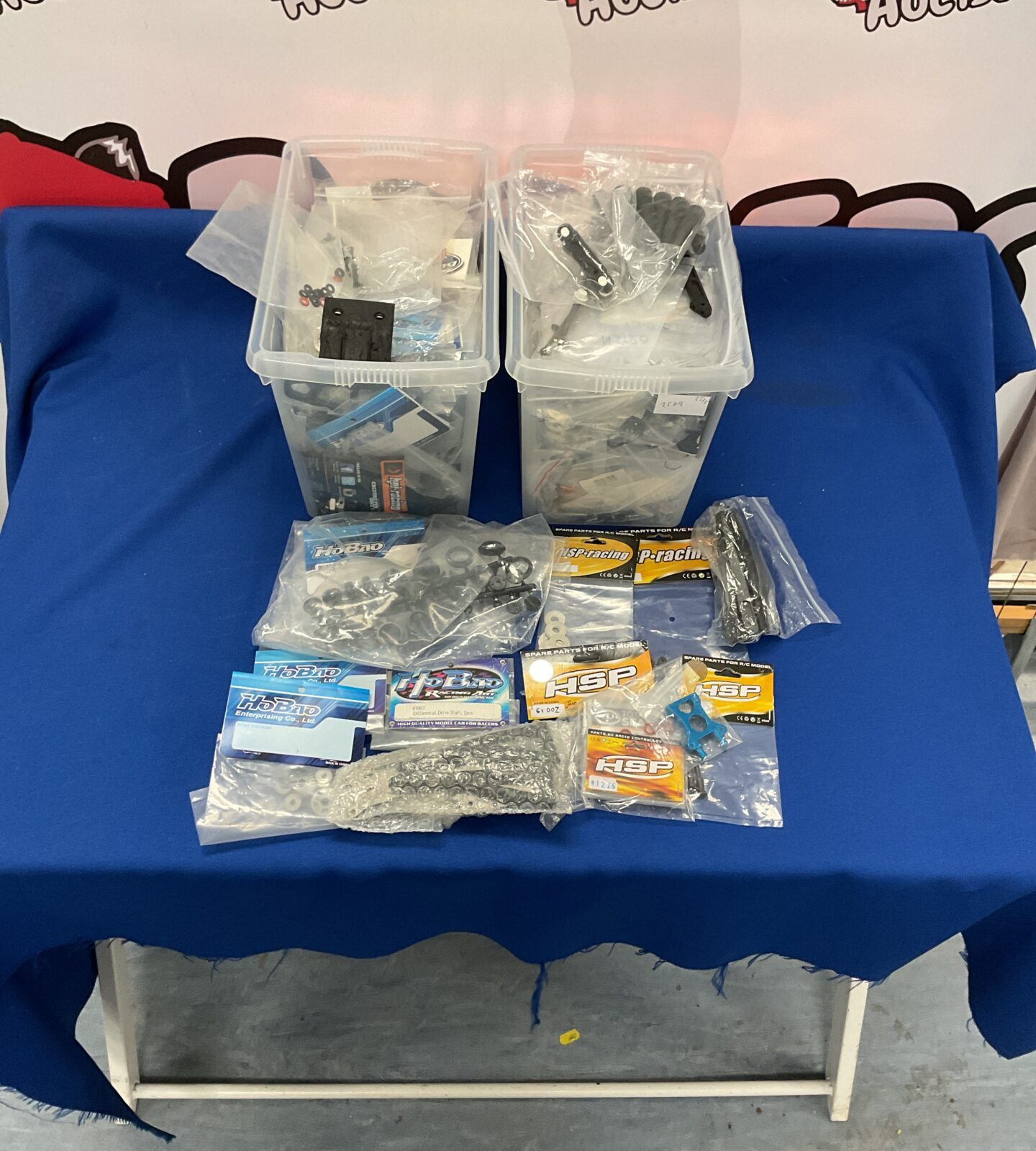 Two boxes of new model rc parts and accessories inc hsp and Hobao