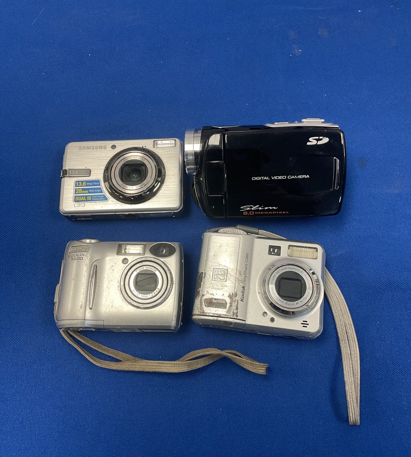 Four digital cameras including nikon & samsung