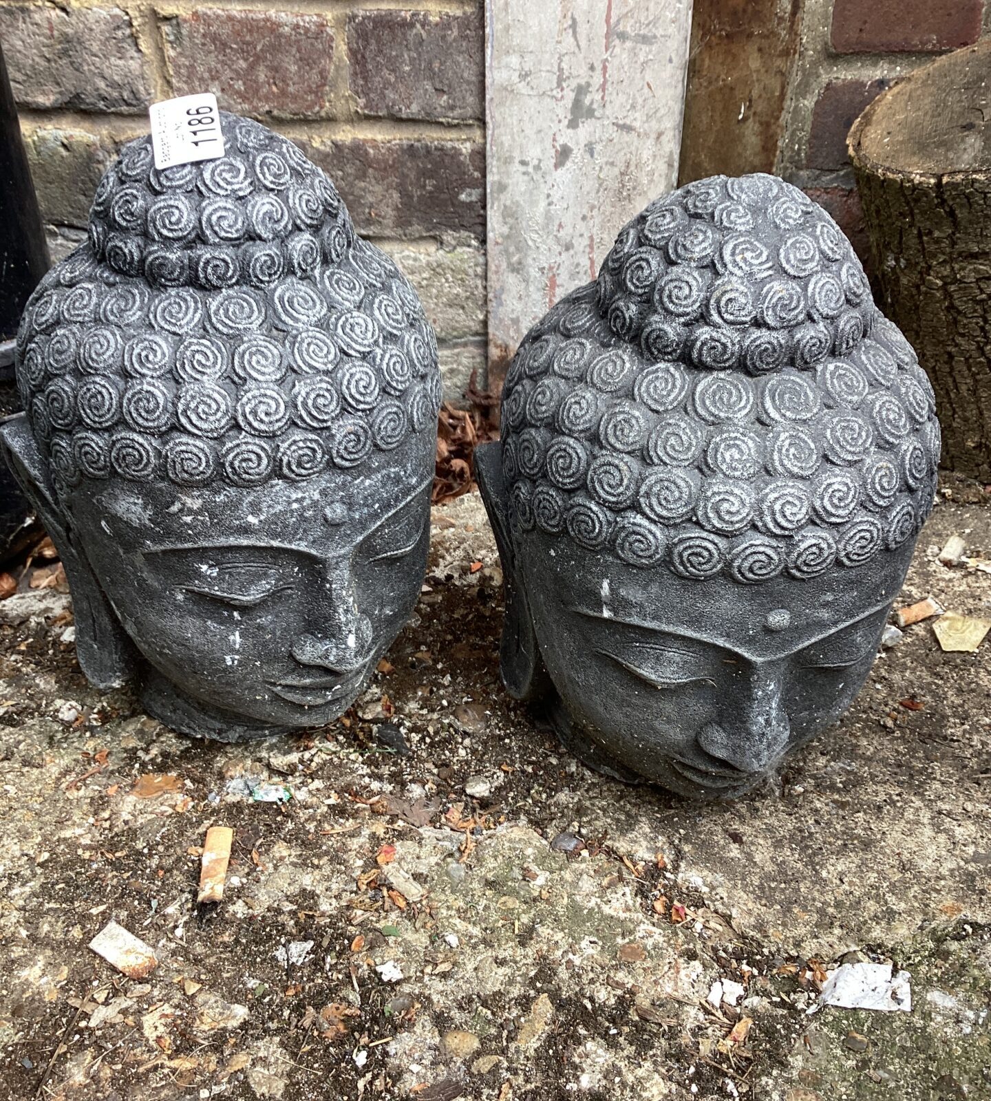 Two garden Buddha Heads