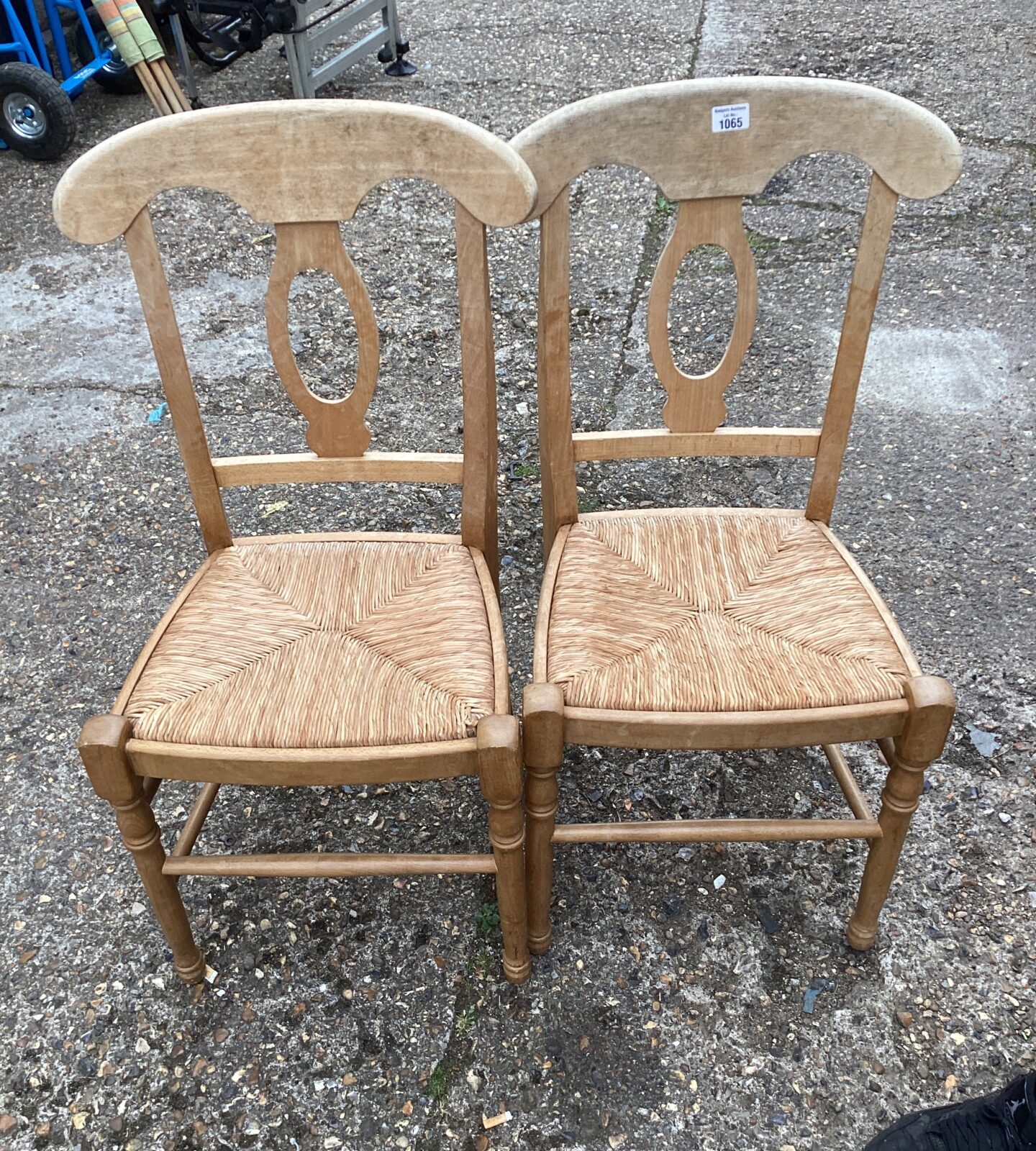 Two woven seated dining chairs