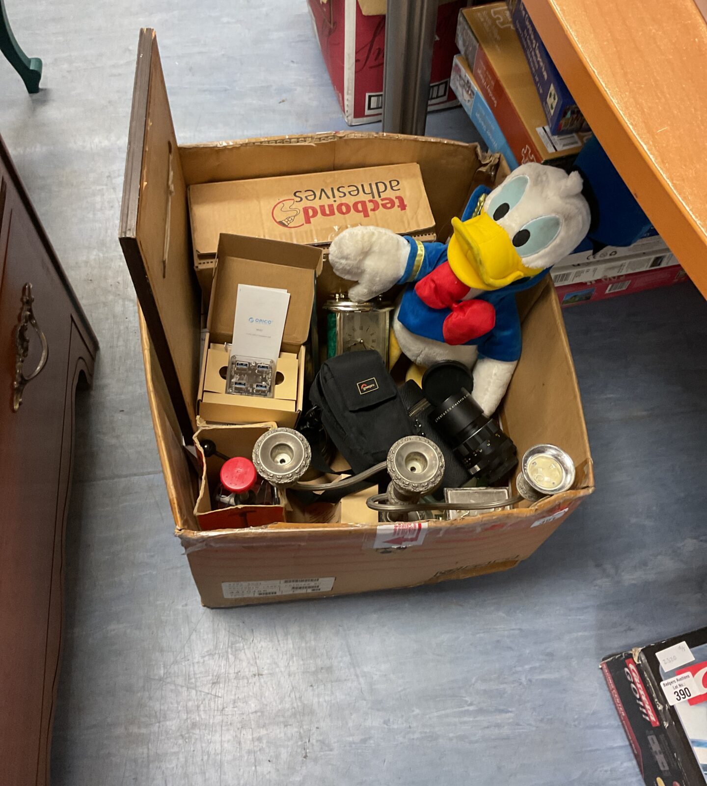 Box of mixed items inc quartz clocks, donald duck plush and other