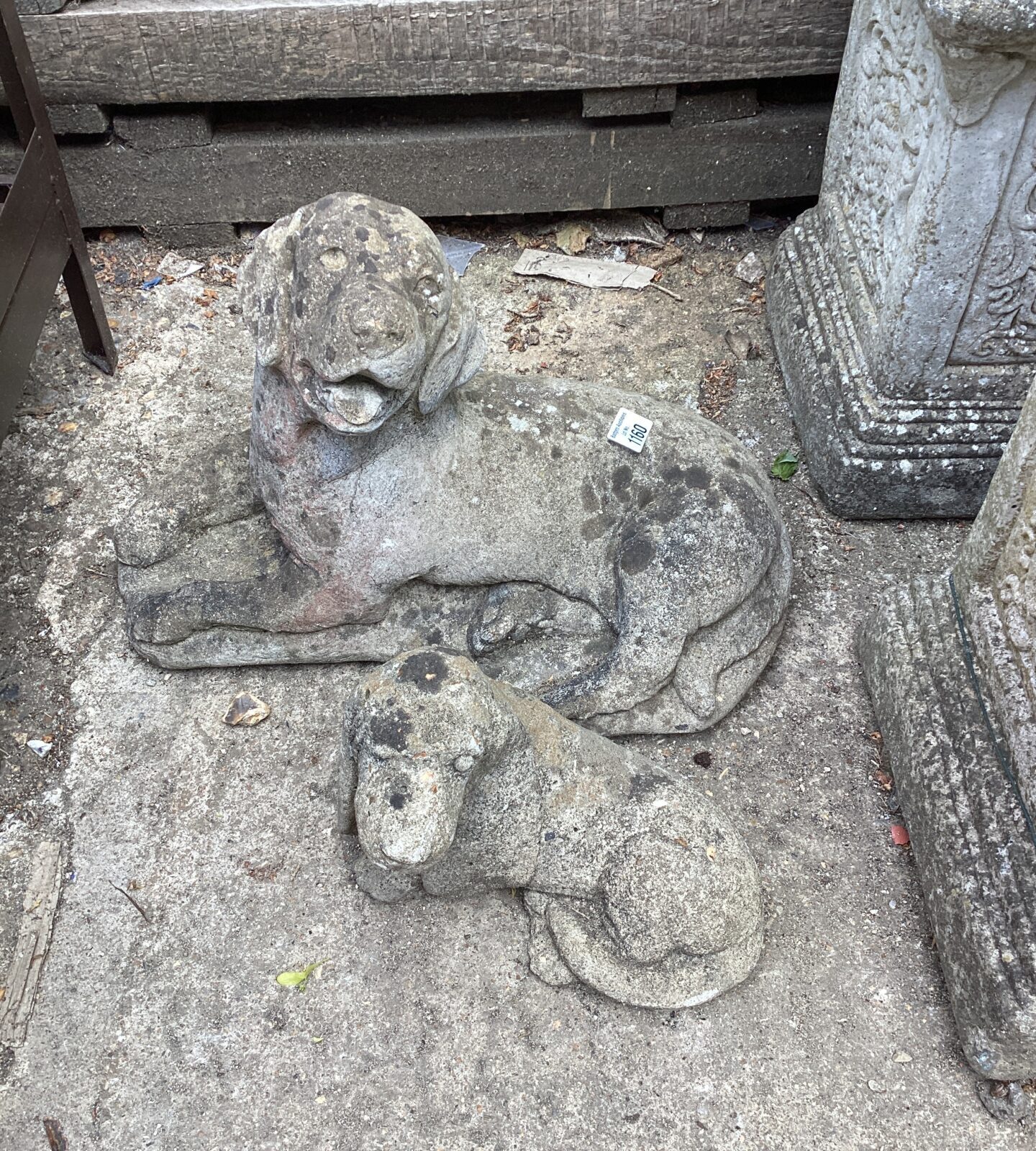 Two dog stone garden ornaments
