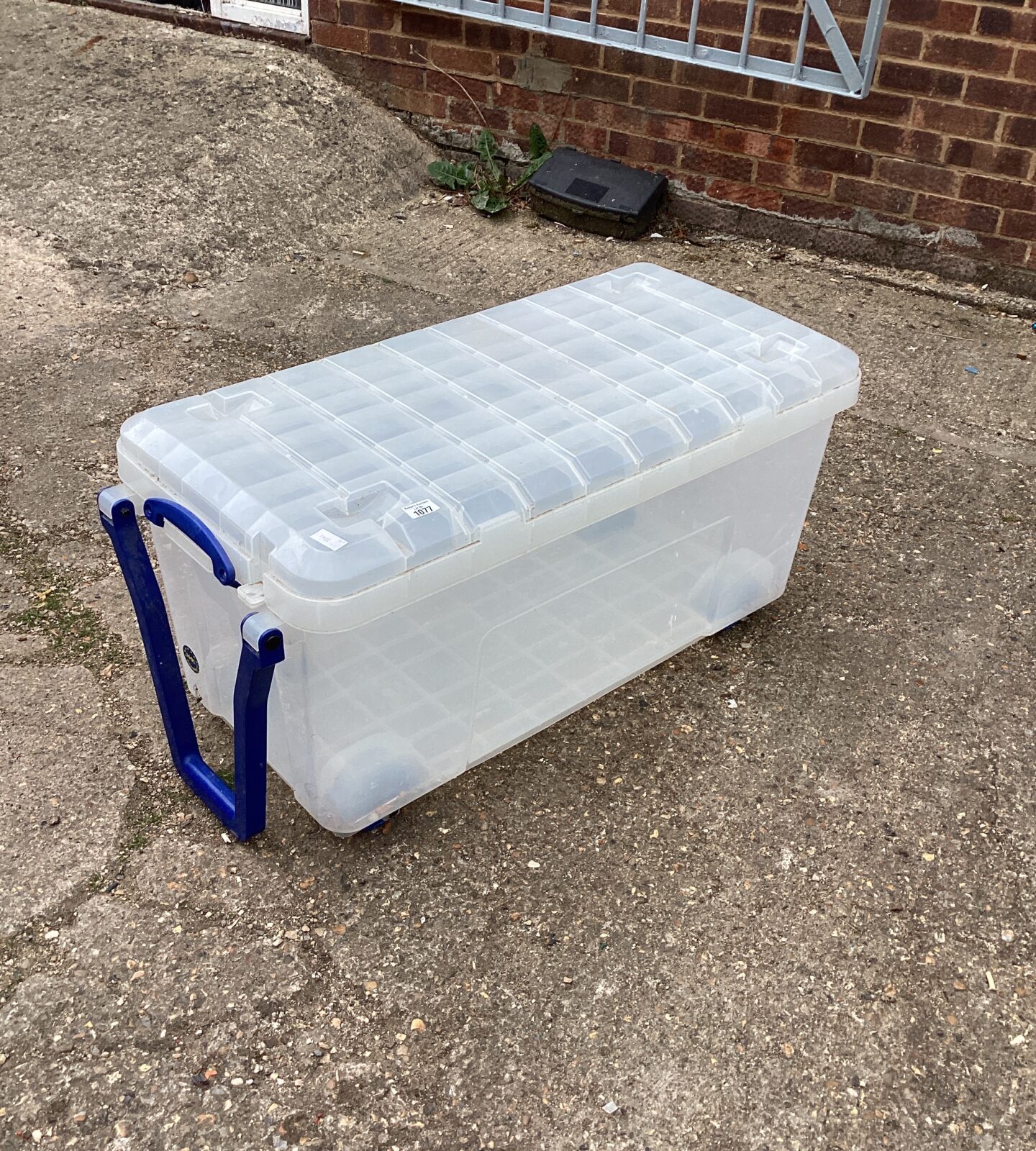 Large plastic storage box on wheels