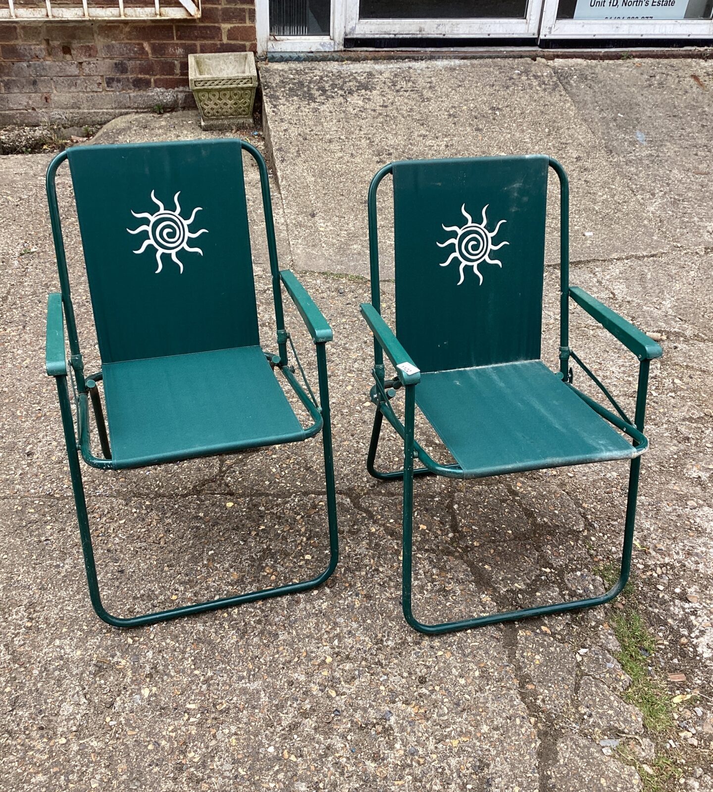 Two folding deck chairs