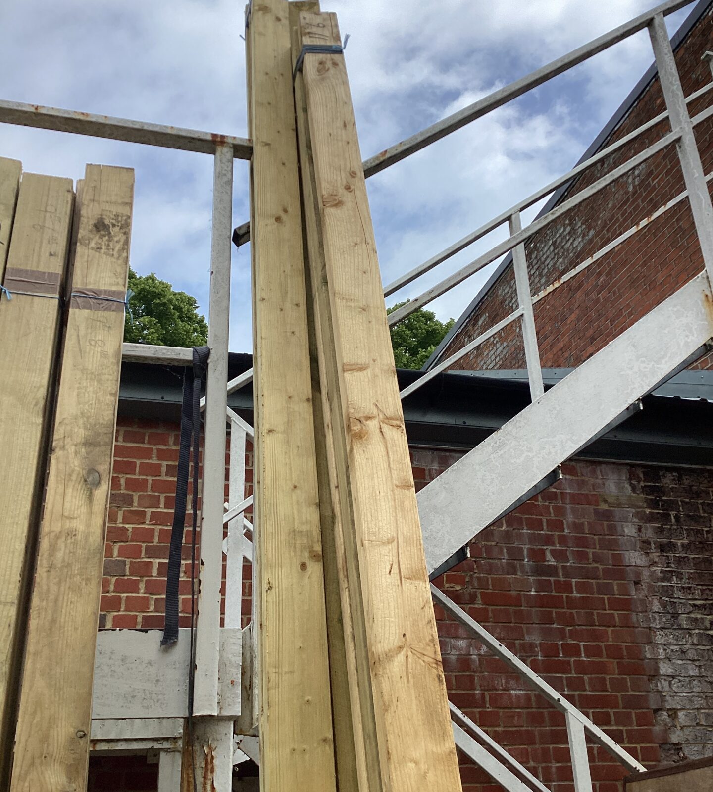 Three bundles of wood measuring 11’6” & 12’6”