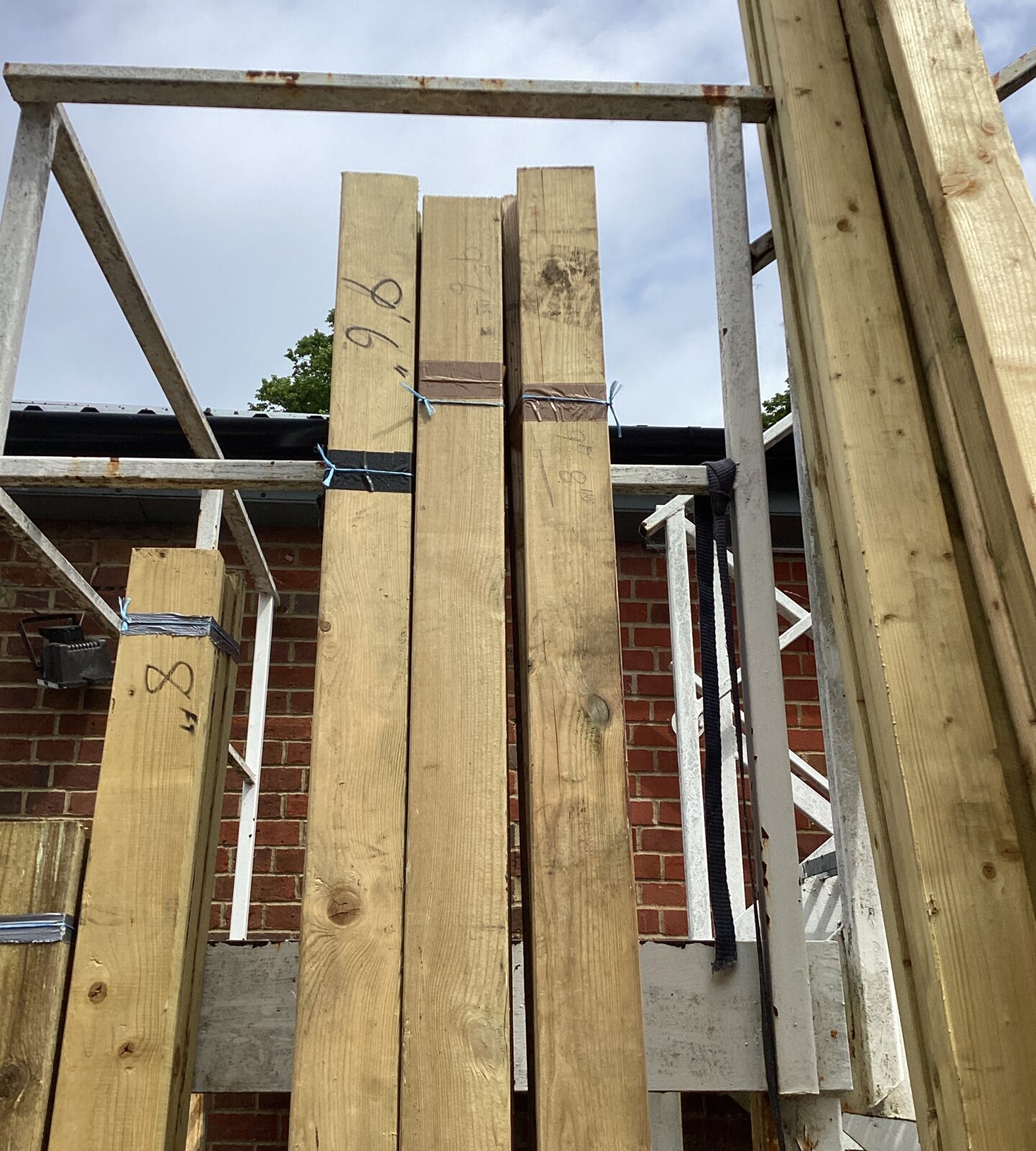 Three bundles of timber measuring 9’6”