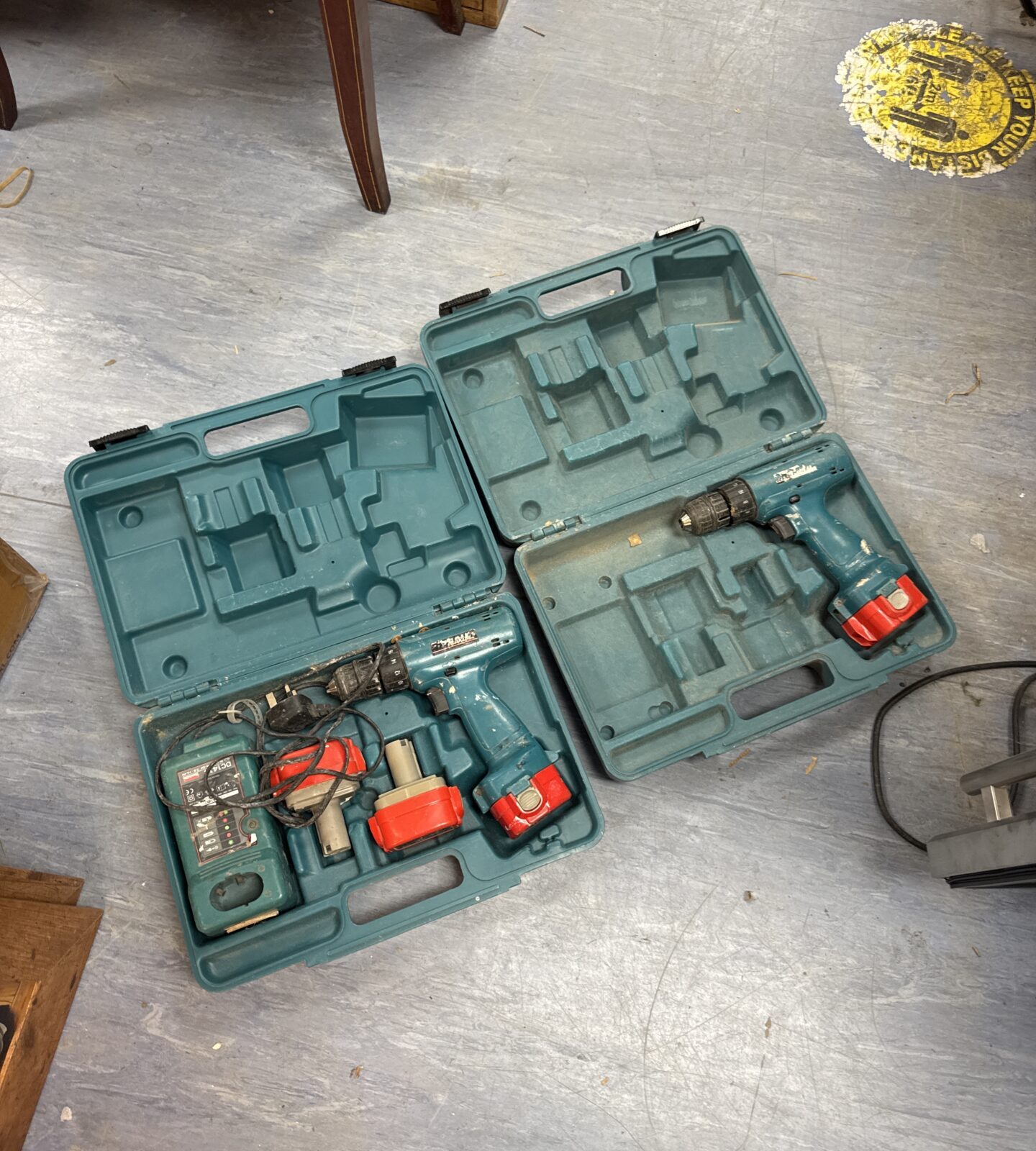 Two Makita cordless drills with batteries & charger - both power on