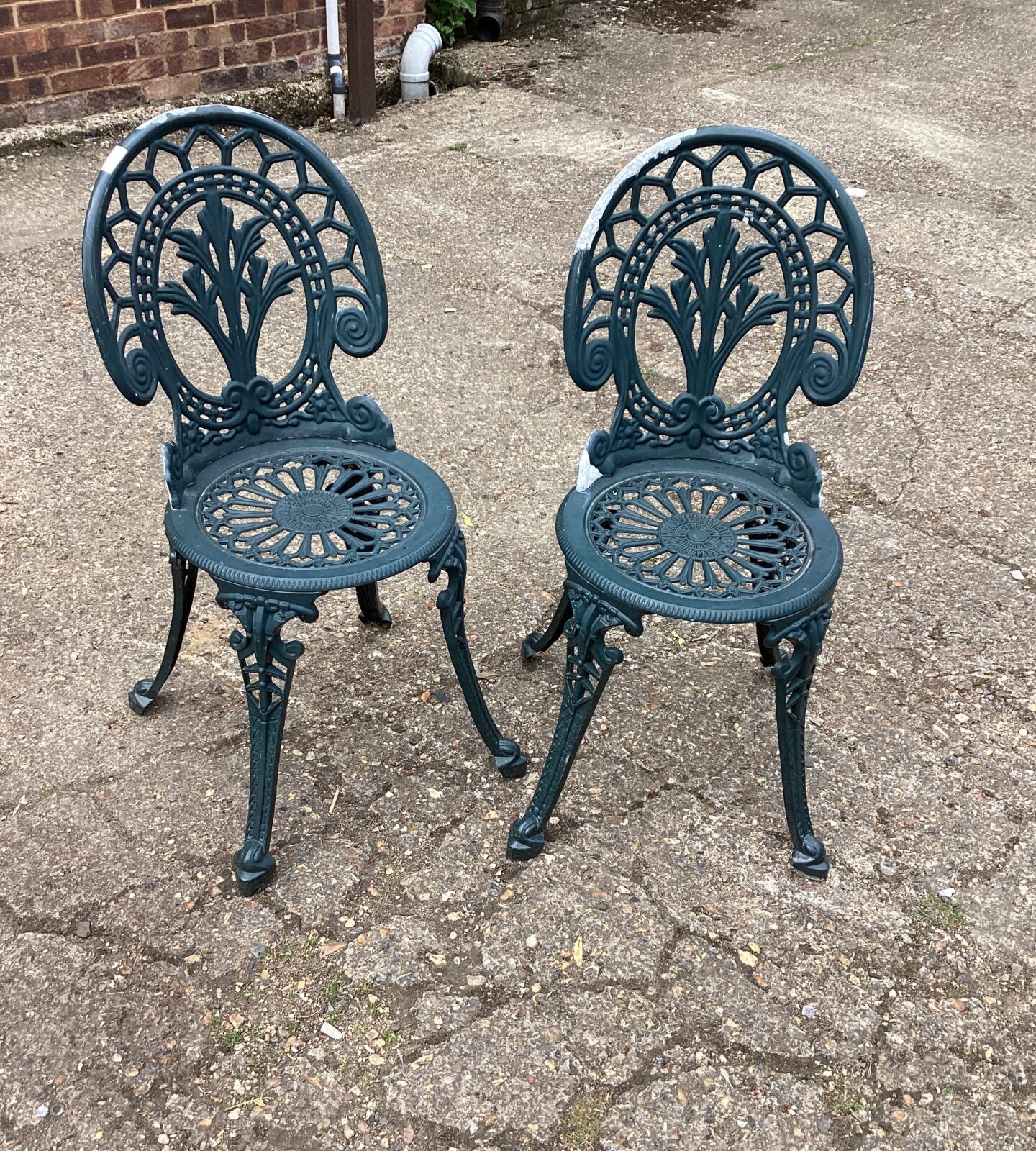 Two metal garden chairs