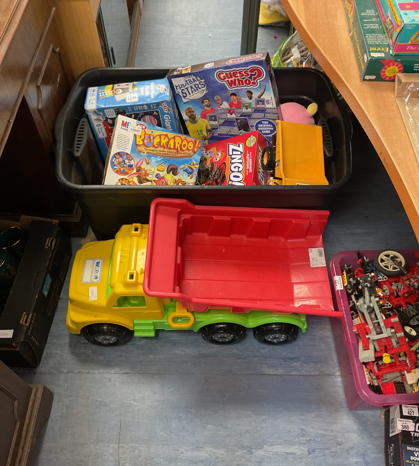 Large box of mixed toys inc large dump truck, board games and other