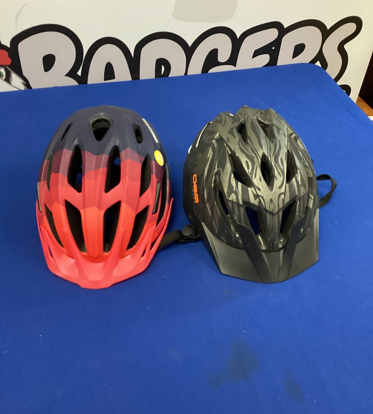 Two cycling crash helmets inc rock rider