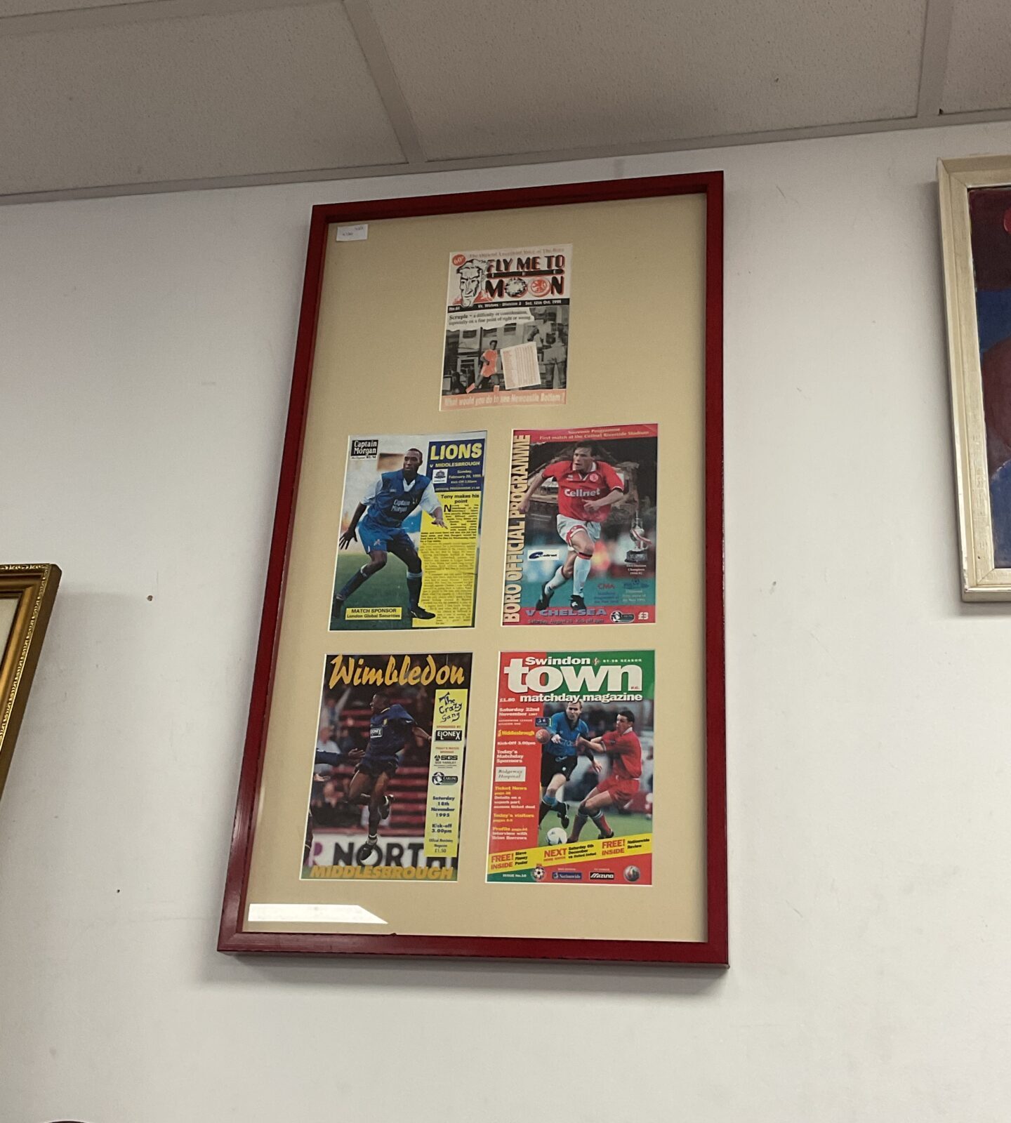 Set of framed 1990s football programmes including wimbledon & swindon