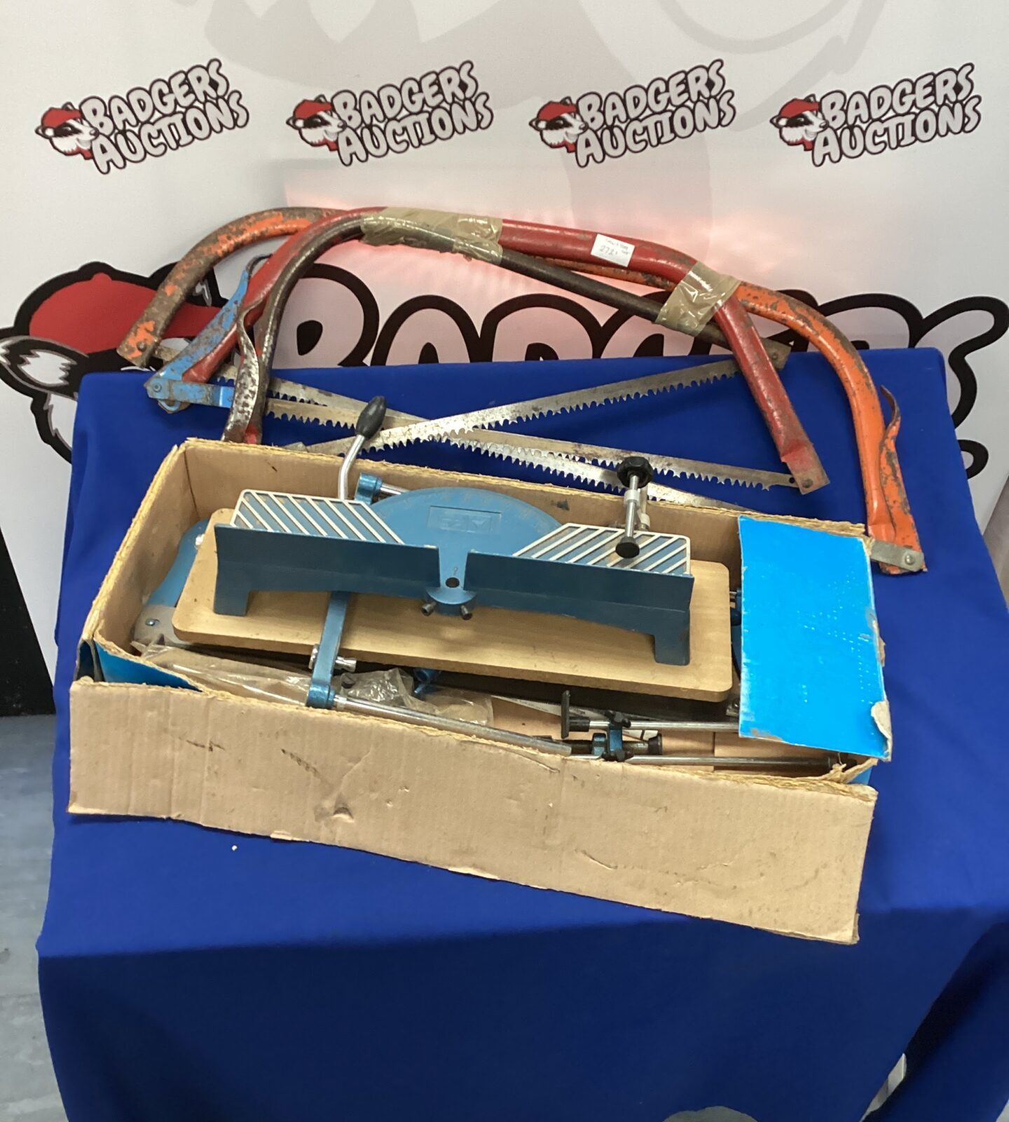 mitre saw and three bow saws