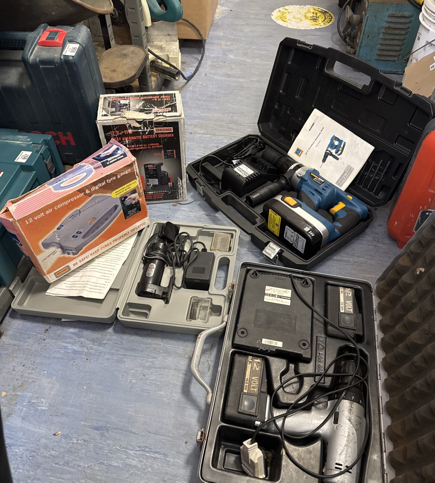 Selection of untested power tools with tyre inflator & battery charger