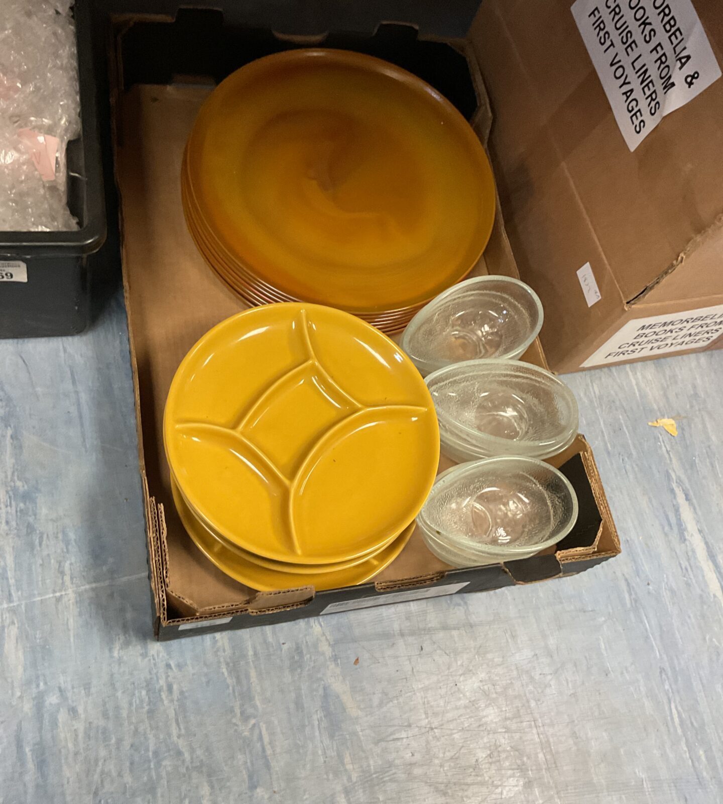 Tray of mixed glass egg pots and plates