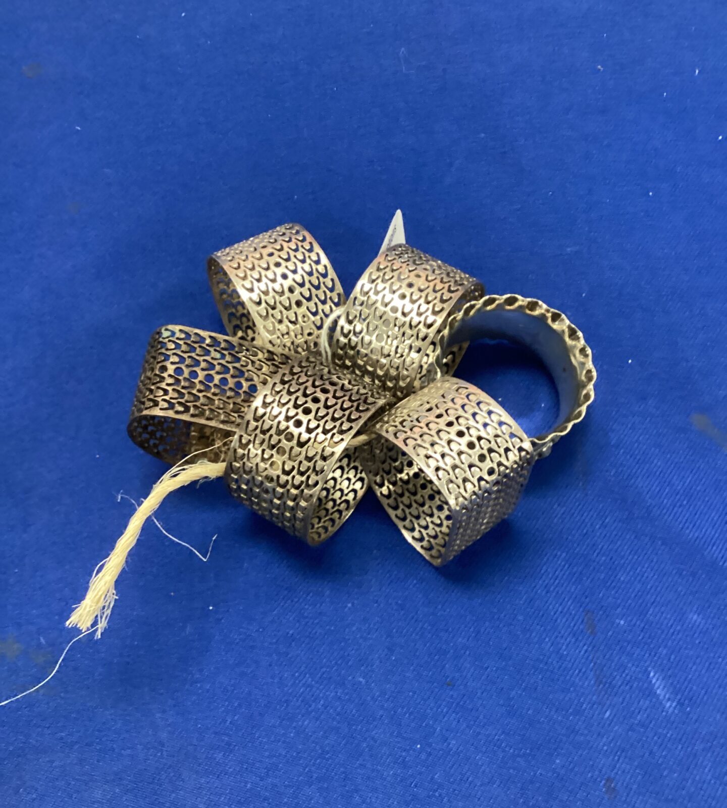 Six white metal napkin rings