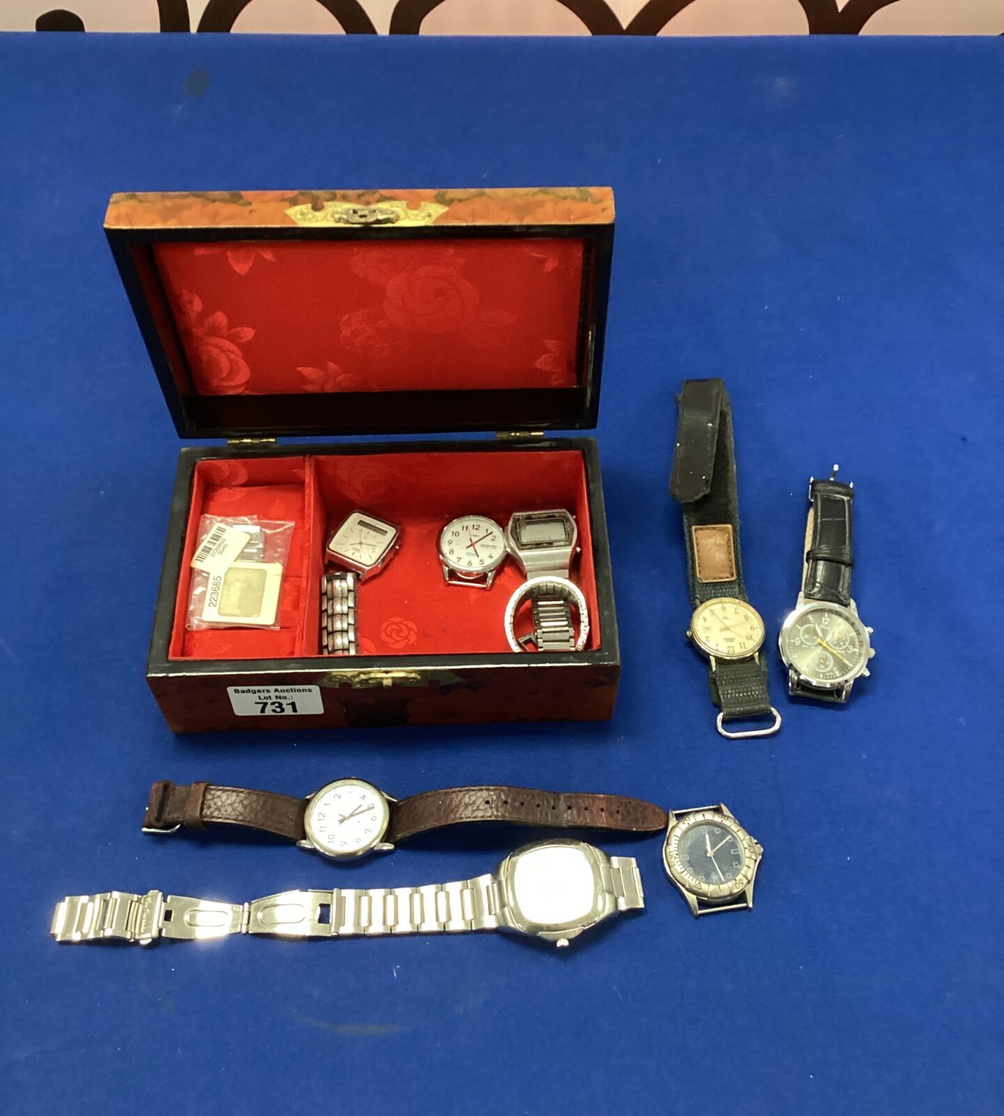 Watch box with assorted watches