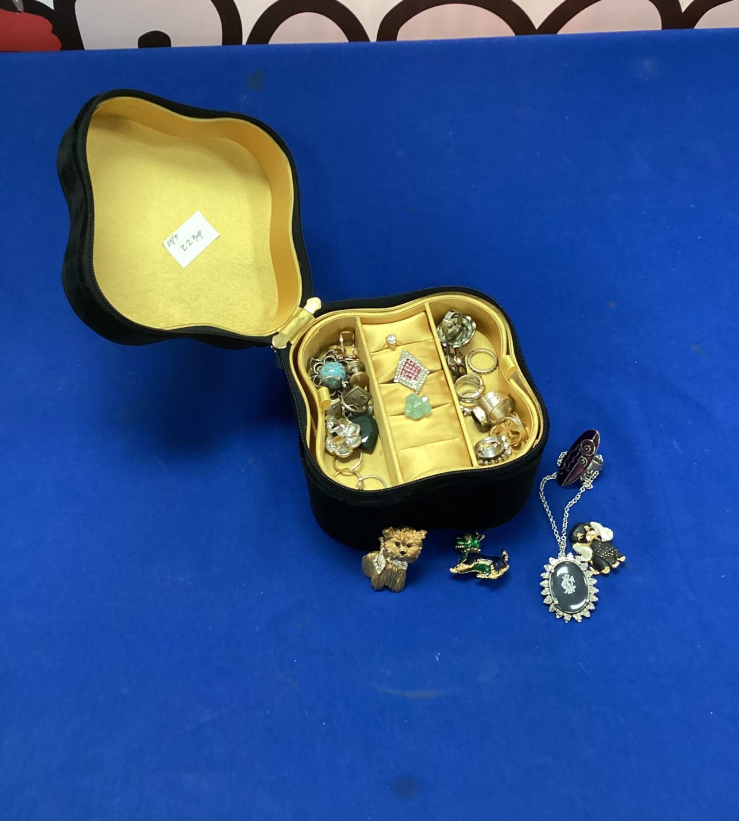 Jewellery box with mixed jewellery inc brooches, rings & necklaces