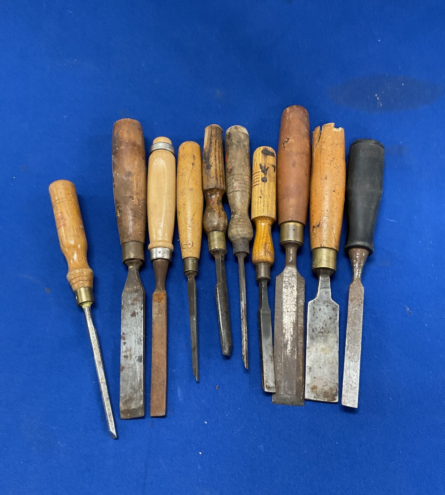 Tub of vintage wood chisels