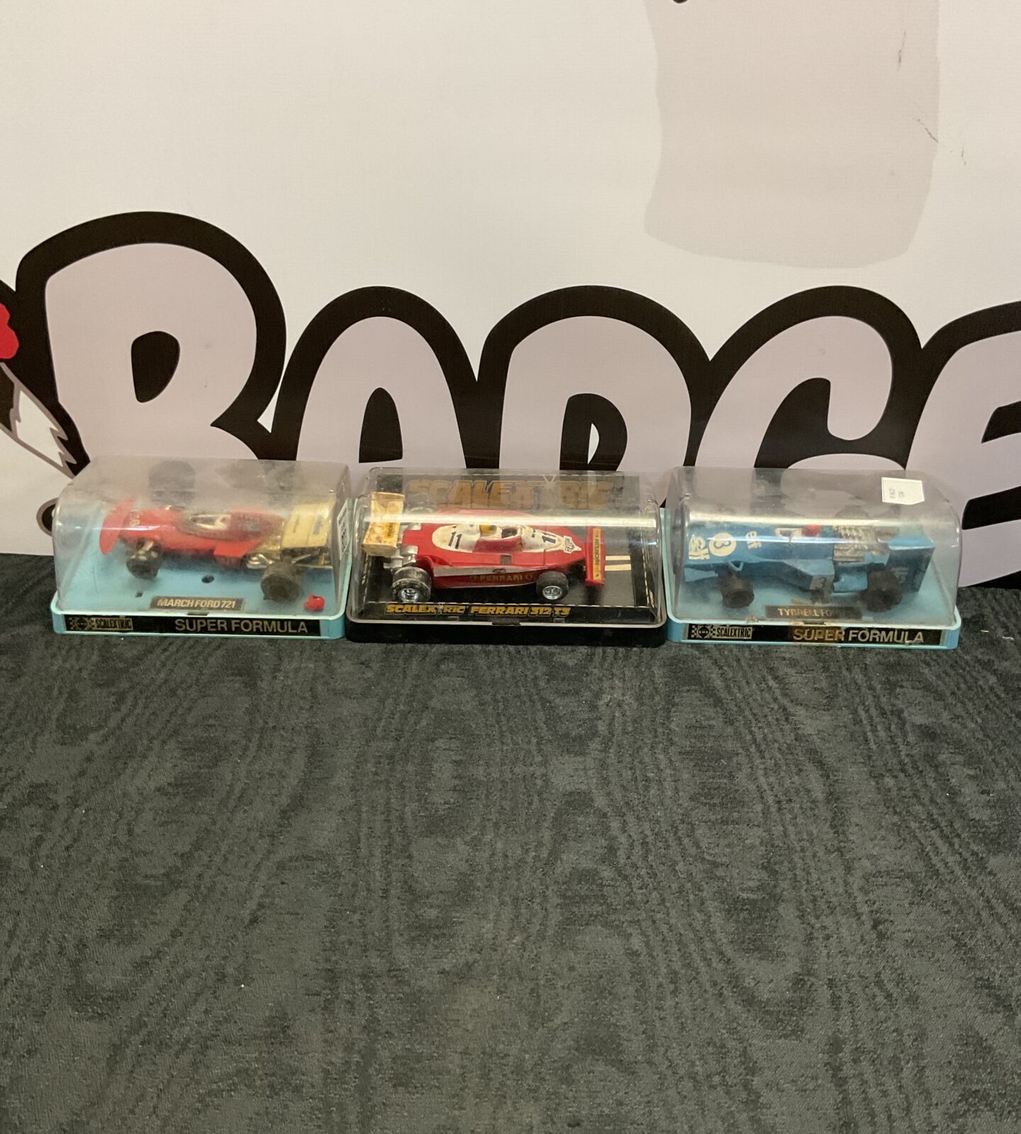 Three cased scalextric cars inc march ford 721, ferrari 312 T3 and tyrell ford