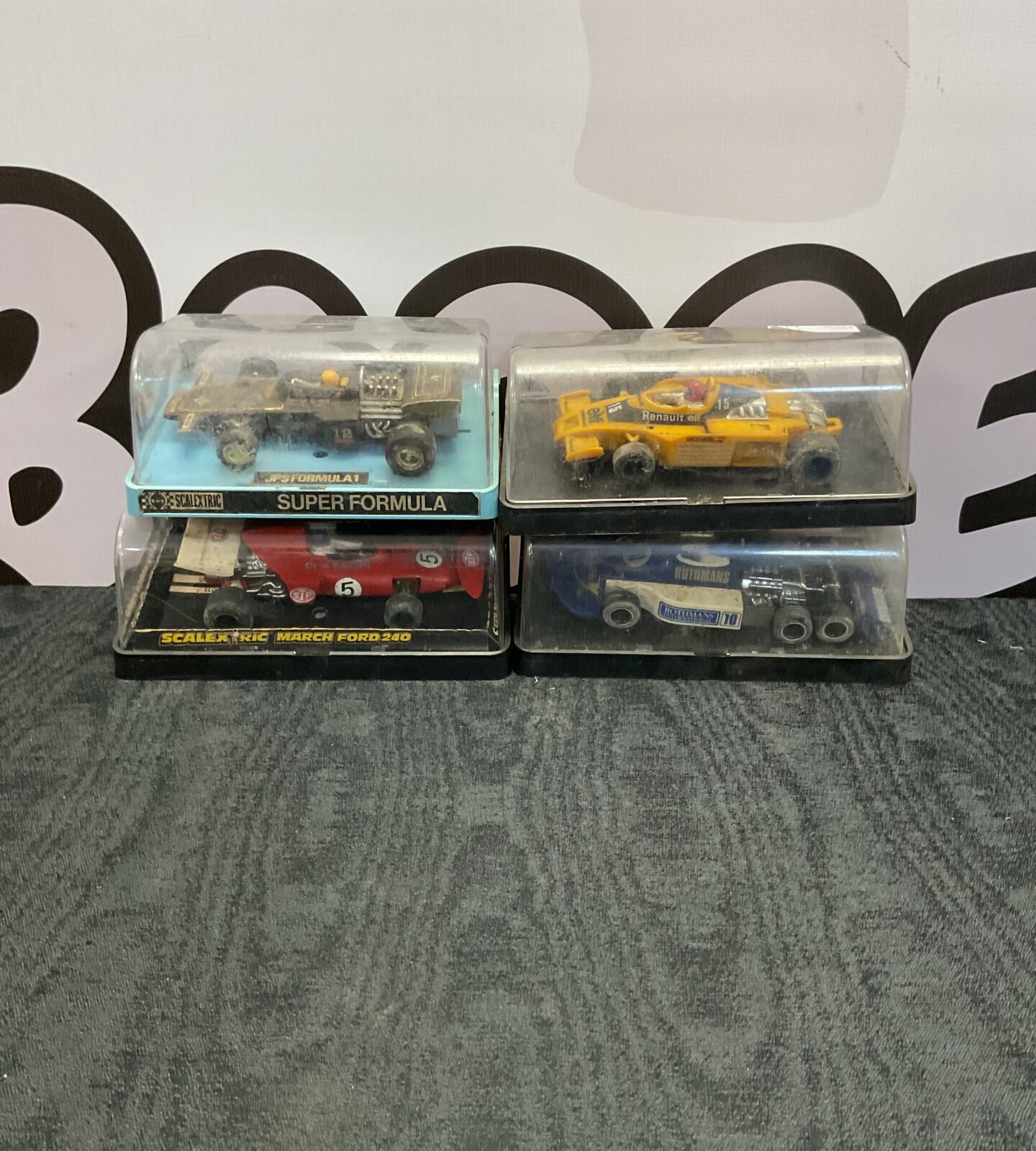 Four vintage scalextric cased model cars