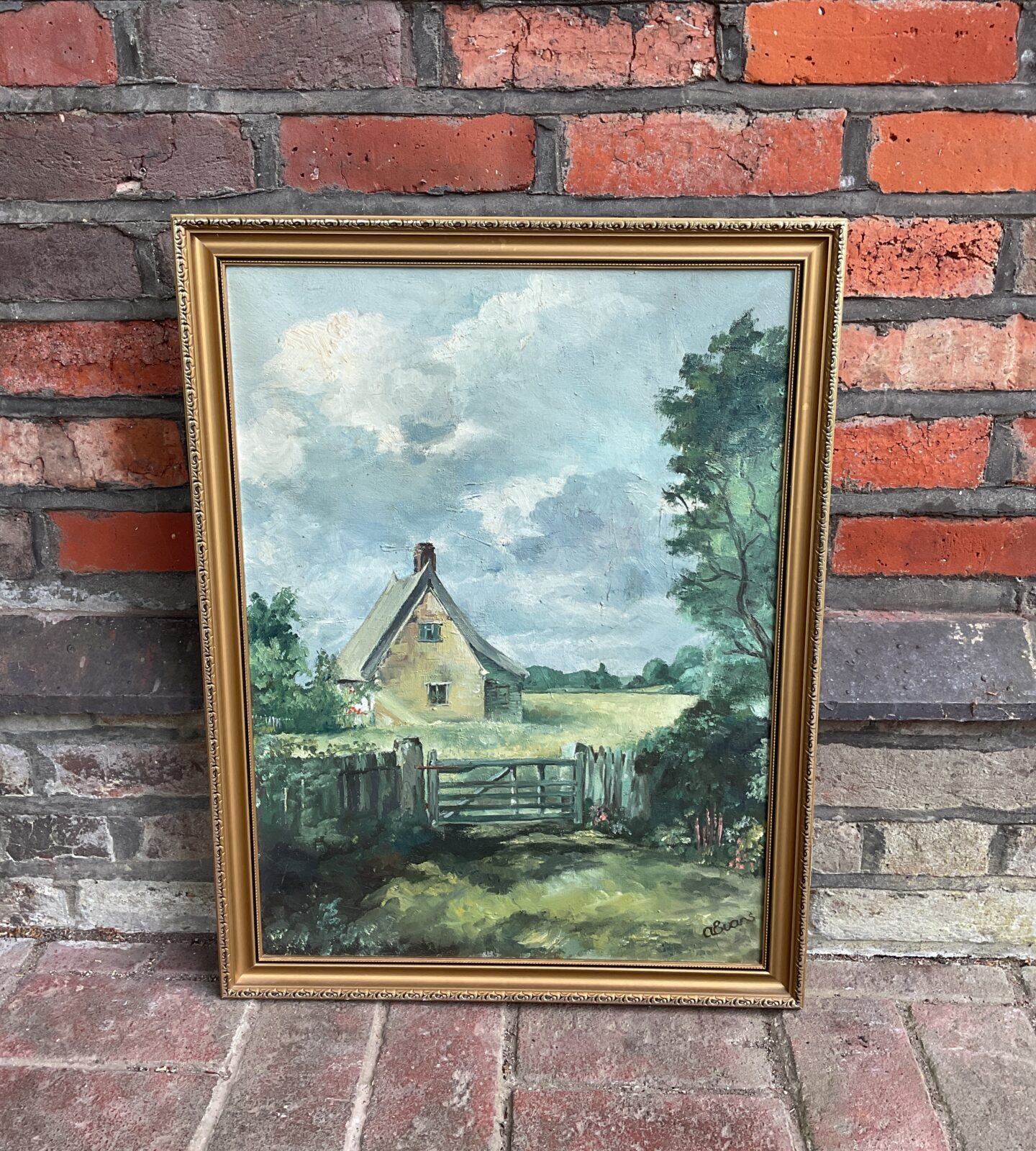 A evans signed oil painting of an English farmhouse