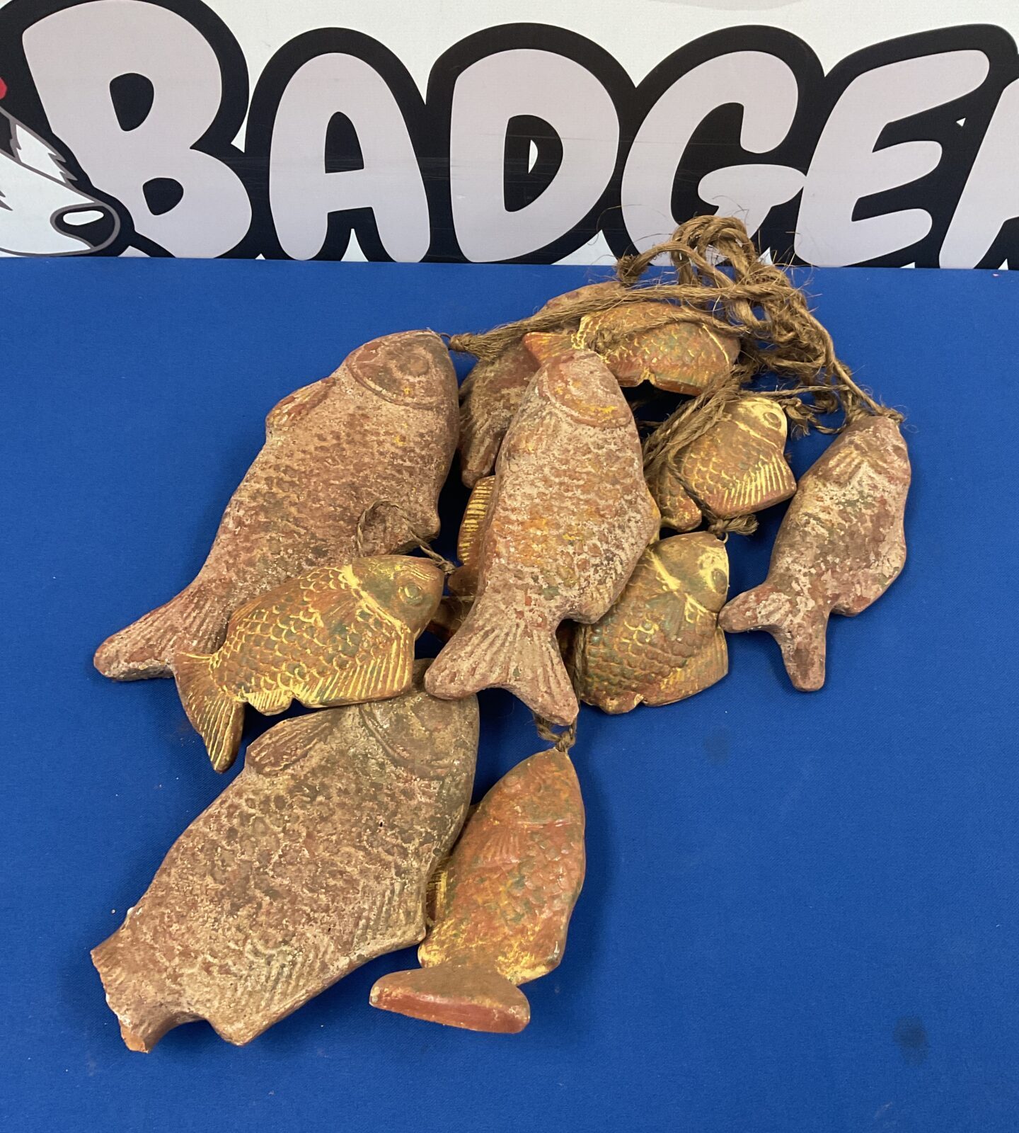 Set of oriental terracotta fish on rope wind chime