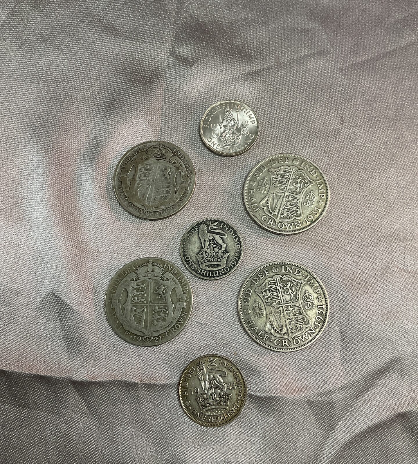 four Half silver crowns two shillings and uncirc 1942 shilling