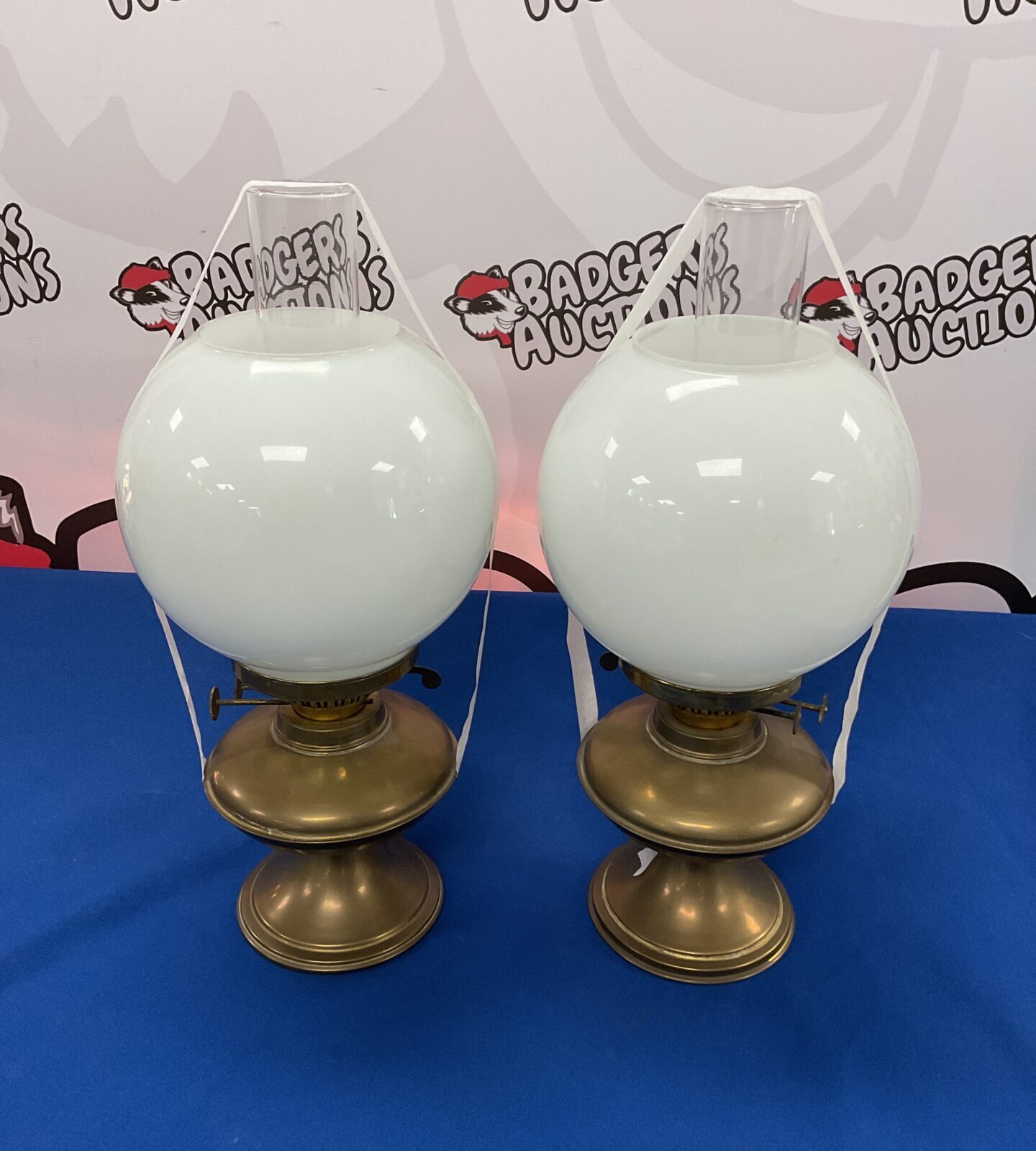 Pair of vintage brass oil lamps with glass shades & chimneys