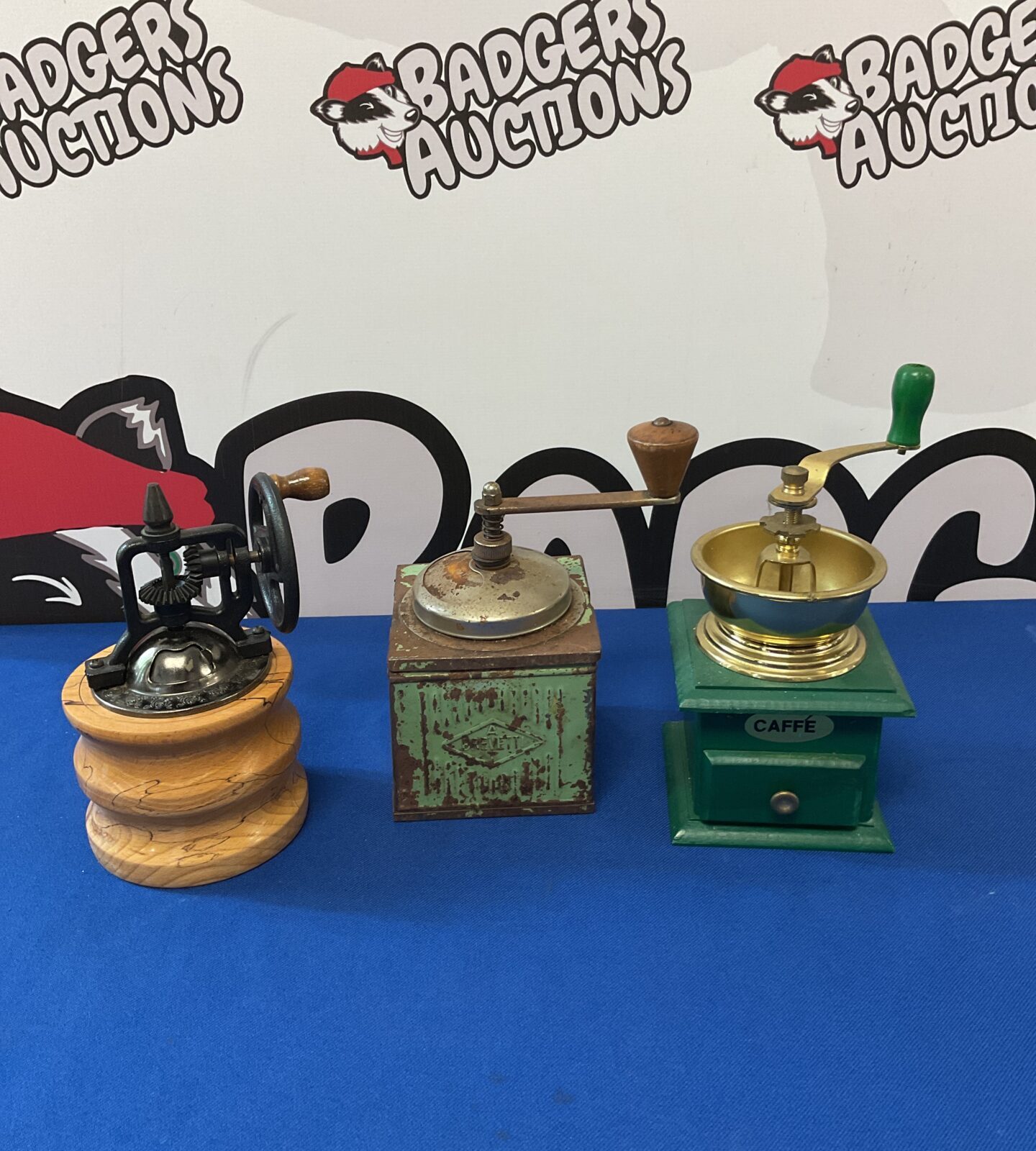 Three coffee mills including vintage tin brevetti grinder