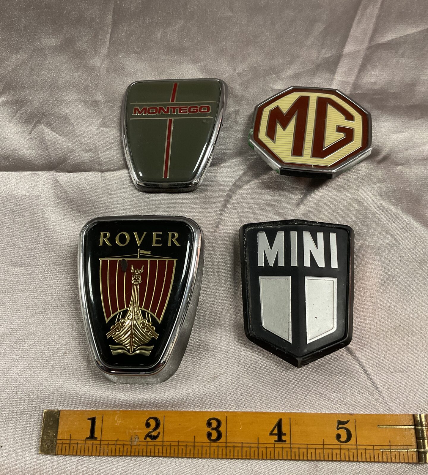 Four car badges Rover Mg Mini and Montego