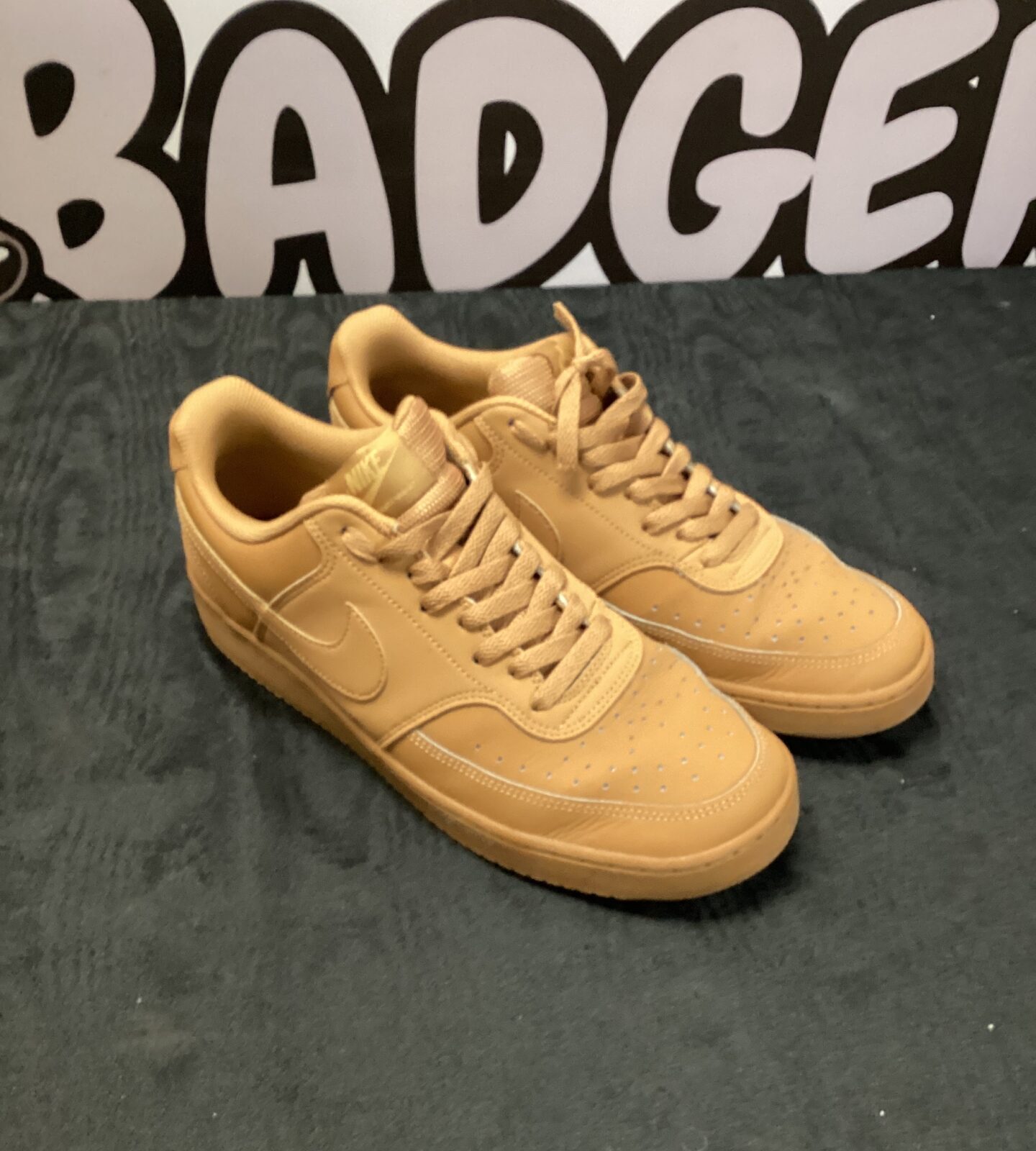Pair of size 9.5 beige nike air force one trainers