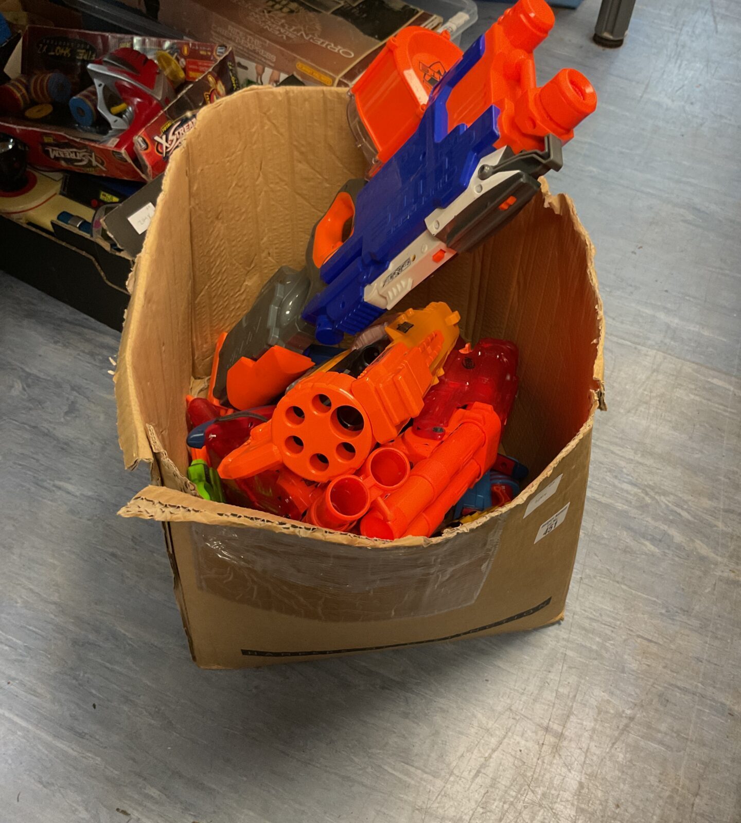 Box of mixed nerf guns and parts