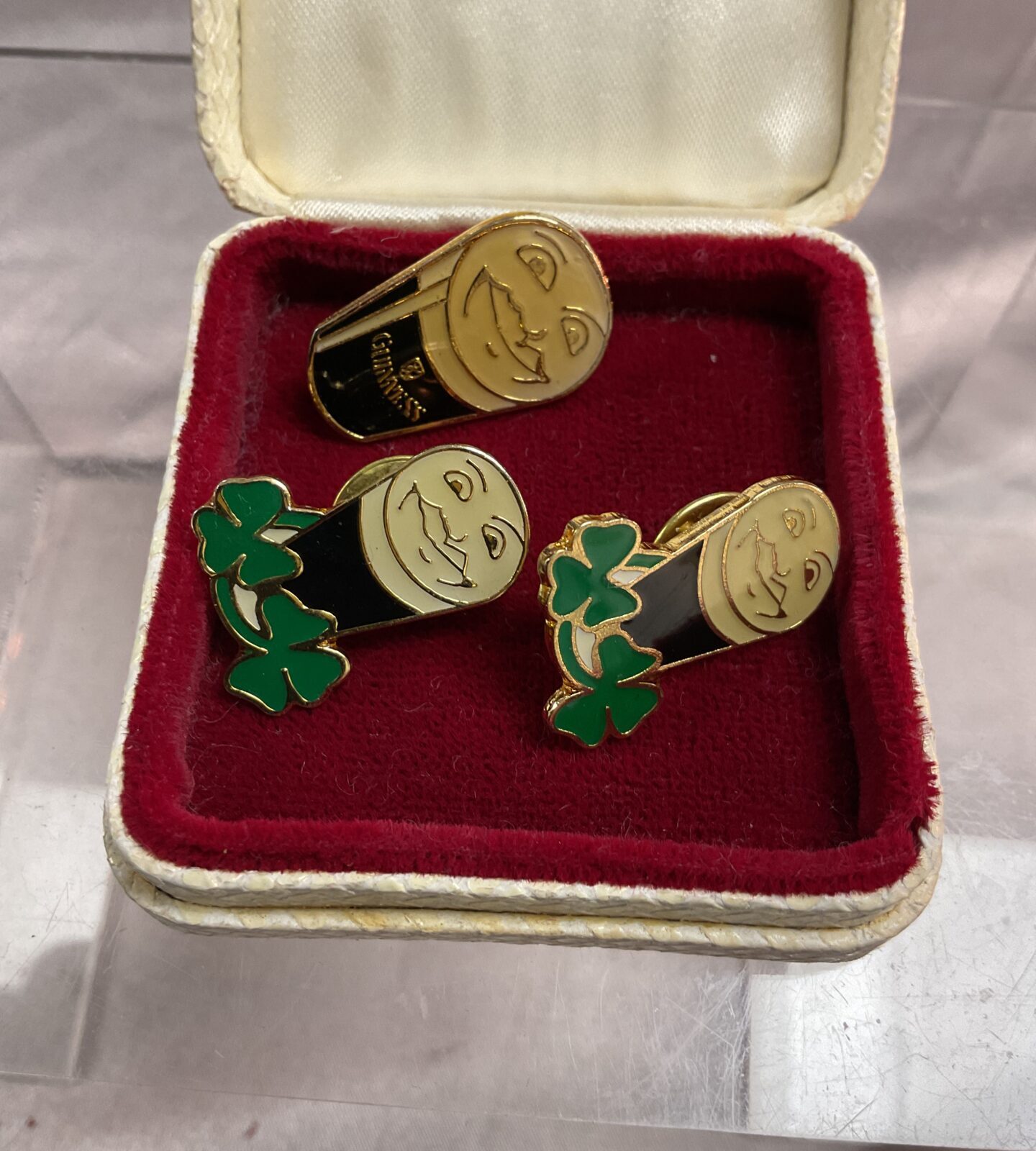 Three vintage Guinness advertising badges