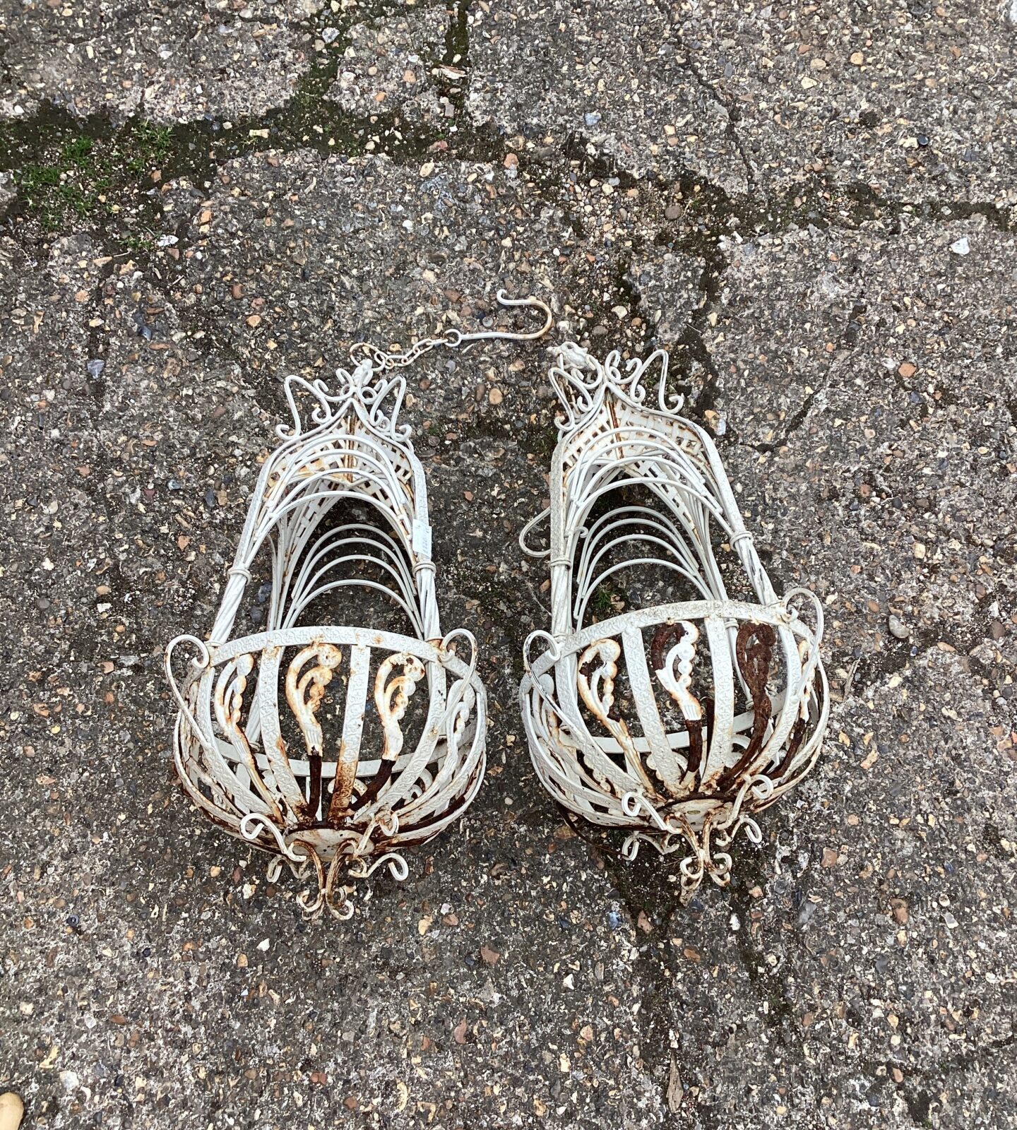Two metal ornate flower baskets