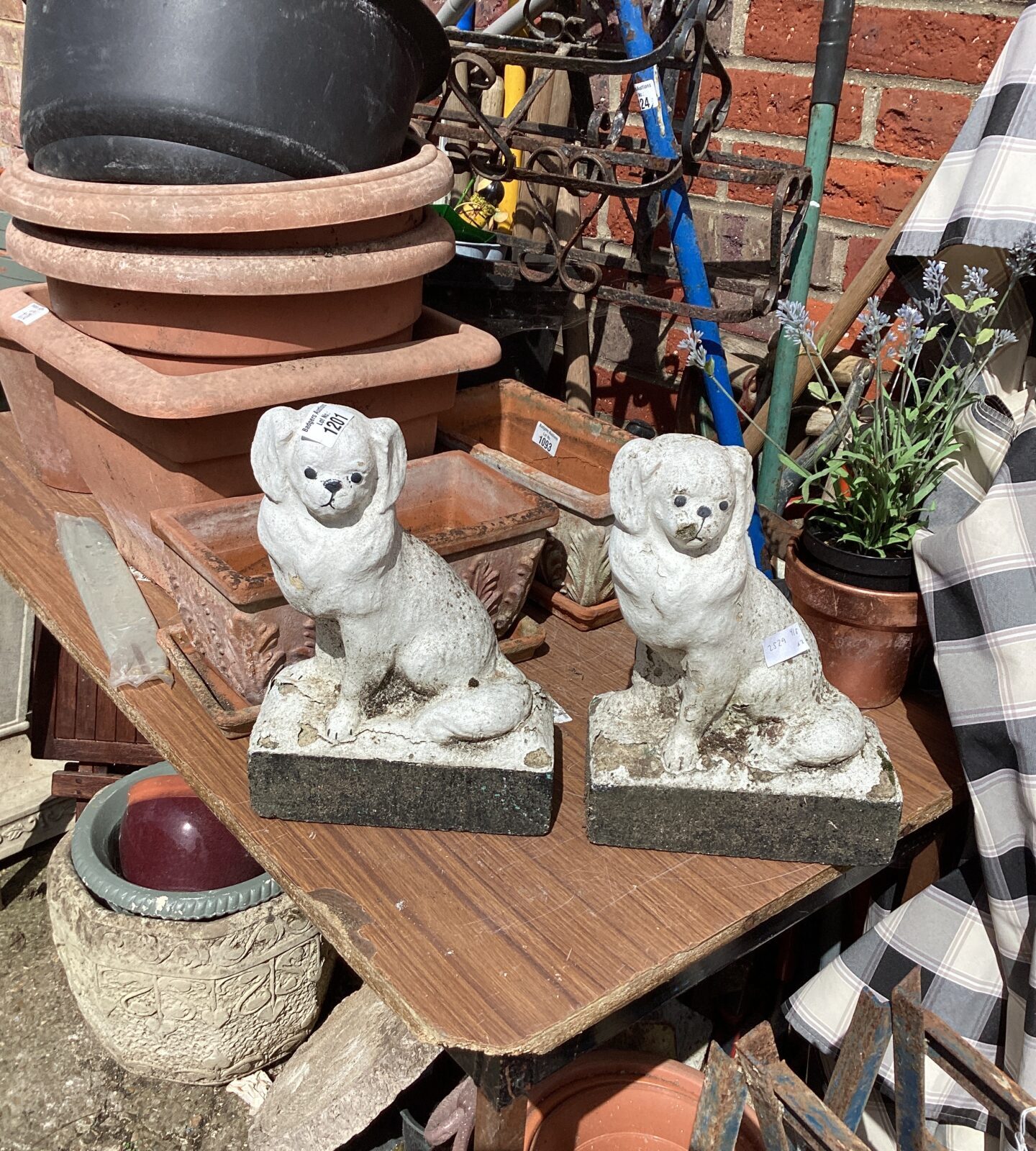 Two stone effect dog garden ornaments