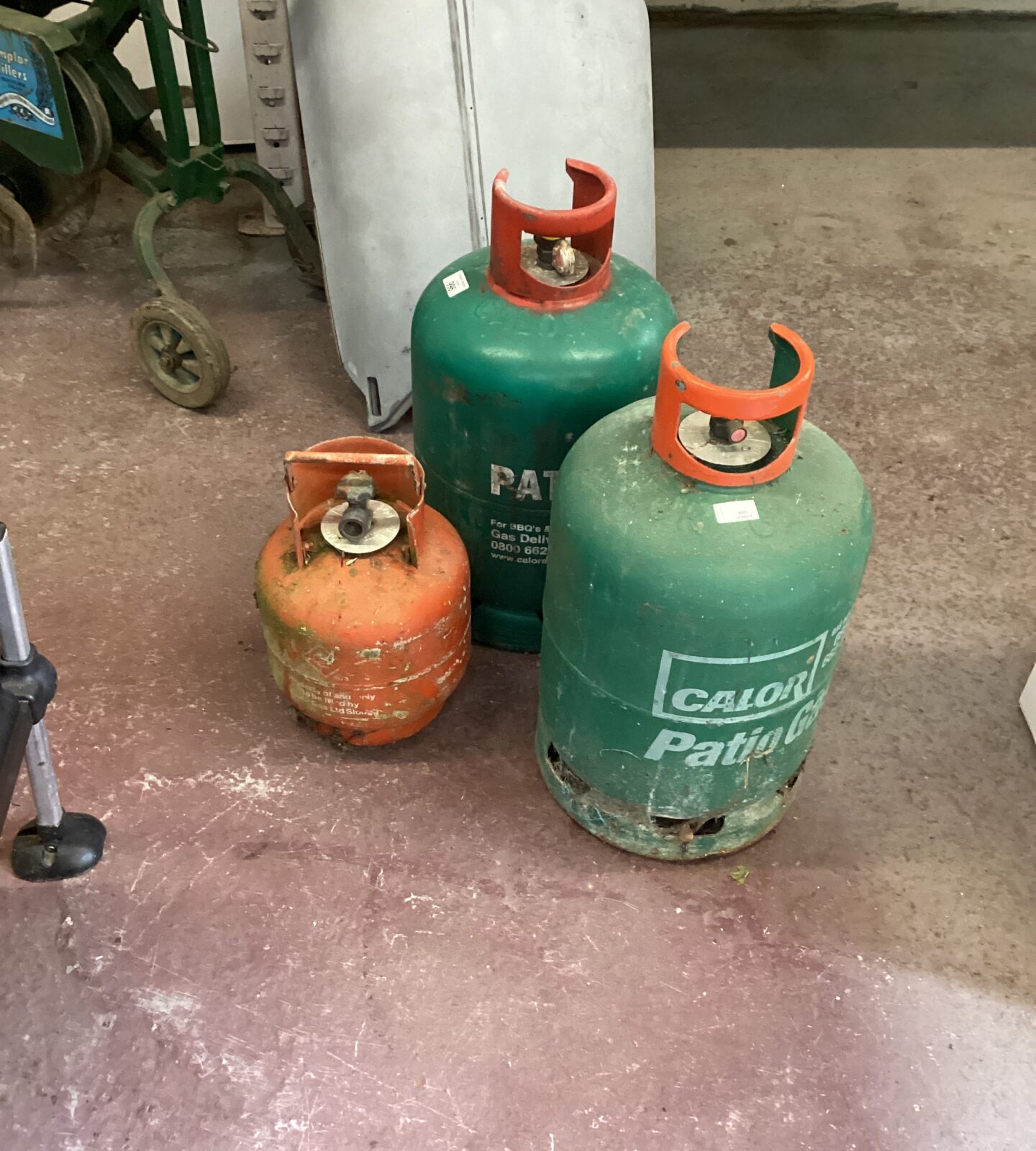 Three patio gas bottles one almost full