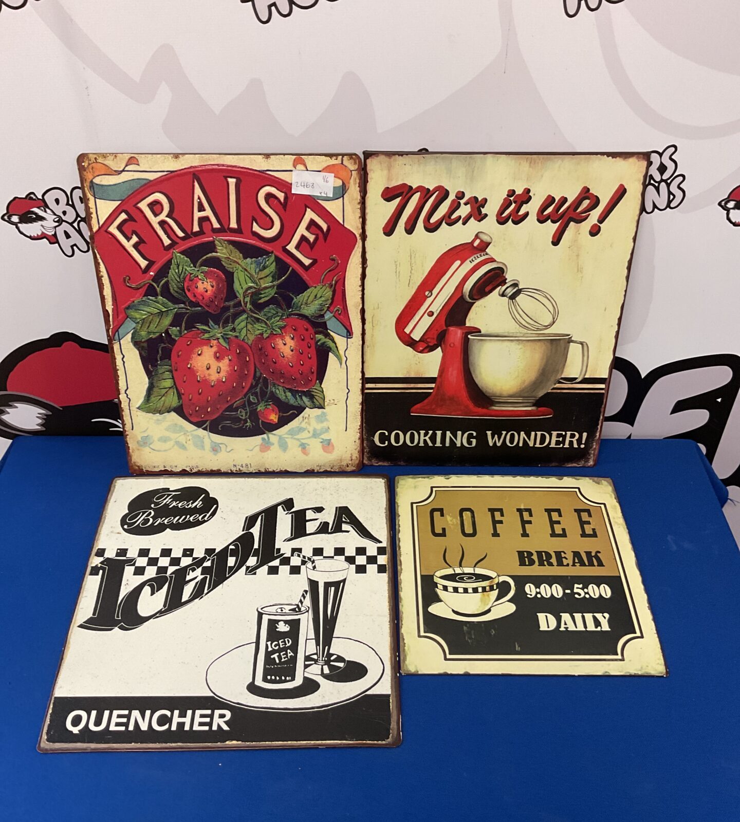 Four tin cafe advertising signs