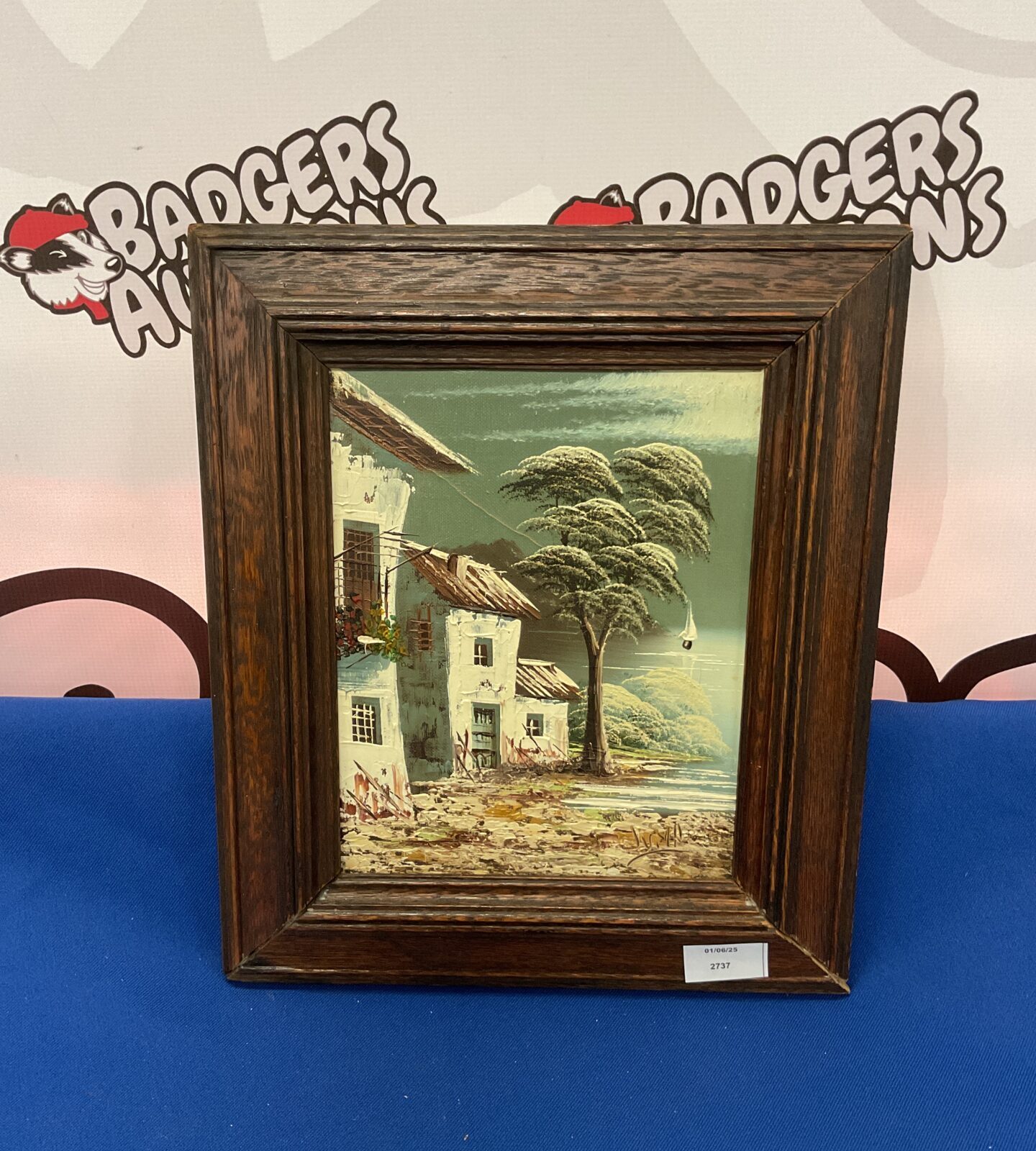 Oil painting signed juna of a Mediterranean village scene