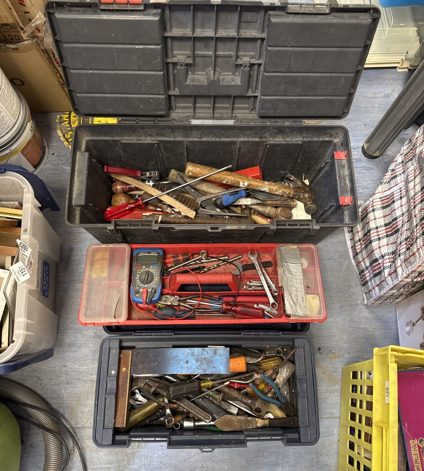 Two plastic toolboxes with contents